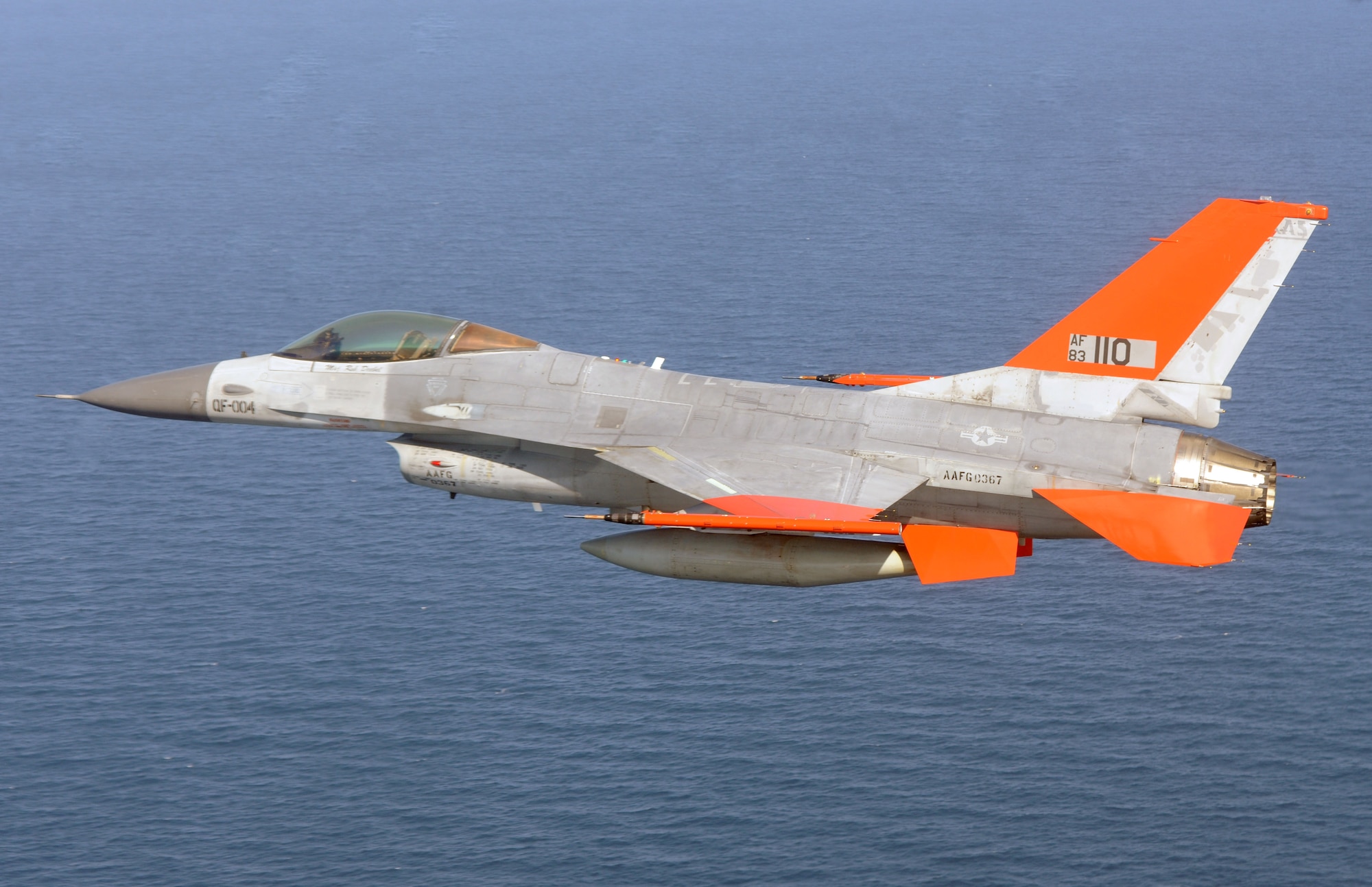 A QF-16 Full Scale Aerial Target from the  82nd Aerial Targets Squadron flies over the Gulf of Mexico during its first unmanned flight at Tyndall Air Force Base Sept. 19.    The 82nd ATRS operates the Department of Defense’s only full-scale aerial target program. The QF-16 will provide a more accurate representation of real world threats for testing and training. (U.S. Air Force photo by Master Sgt. J. Scott Wilcox). 