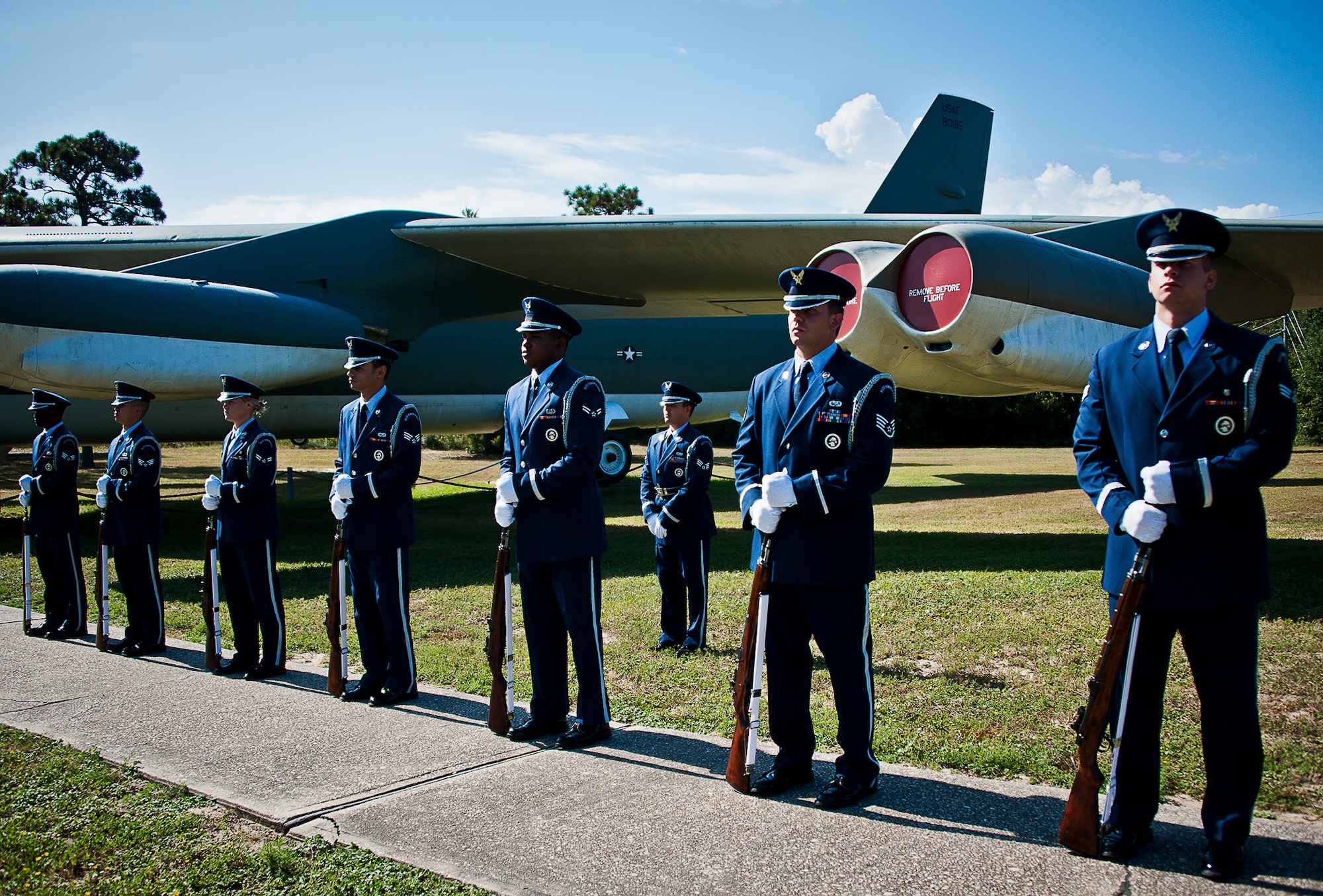 Team Eglin honor guard members stand ready for the rifle volley at Eglin’s POW/MIA remembrance ceremony Sept. 20 at the Air Force Armament Museum.  The ceremony paid tribute to those military members who have yet to return home from defending America. The event featured tributes, guest speakers and honor guard procedures. (U.S. Air Force photo/Tech. Sgt. Jasmin Taylor)