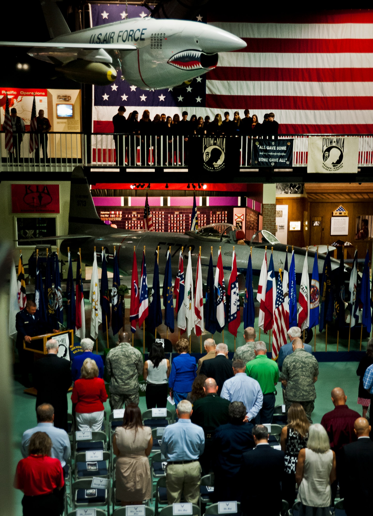 Attendees bow their heads for a prayer during Eglin’s POW/MIA remembrance ceremony Sept. 20 at the Air Force Armament Museum.  The ceremony paid tribute to those military members who have yet to return home from defending America. The event featured tributes, guest speakers and honor guard procedures. (U.S. Air Force photo/Tech. Sgt. Jasmin Taylor)