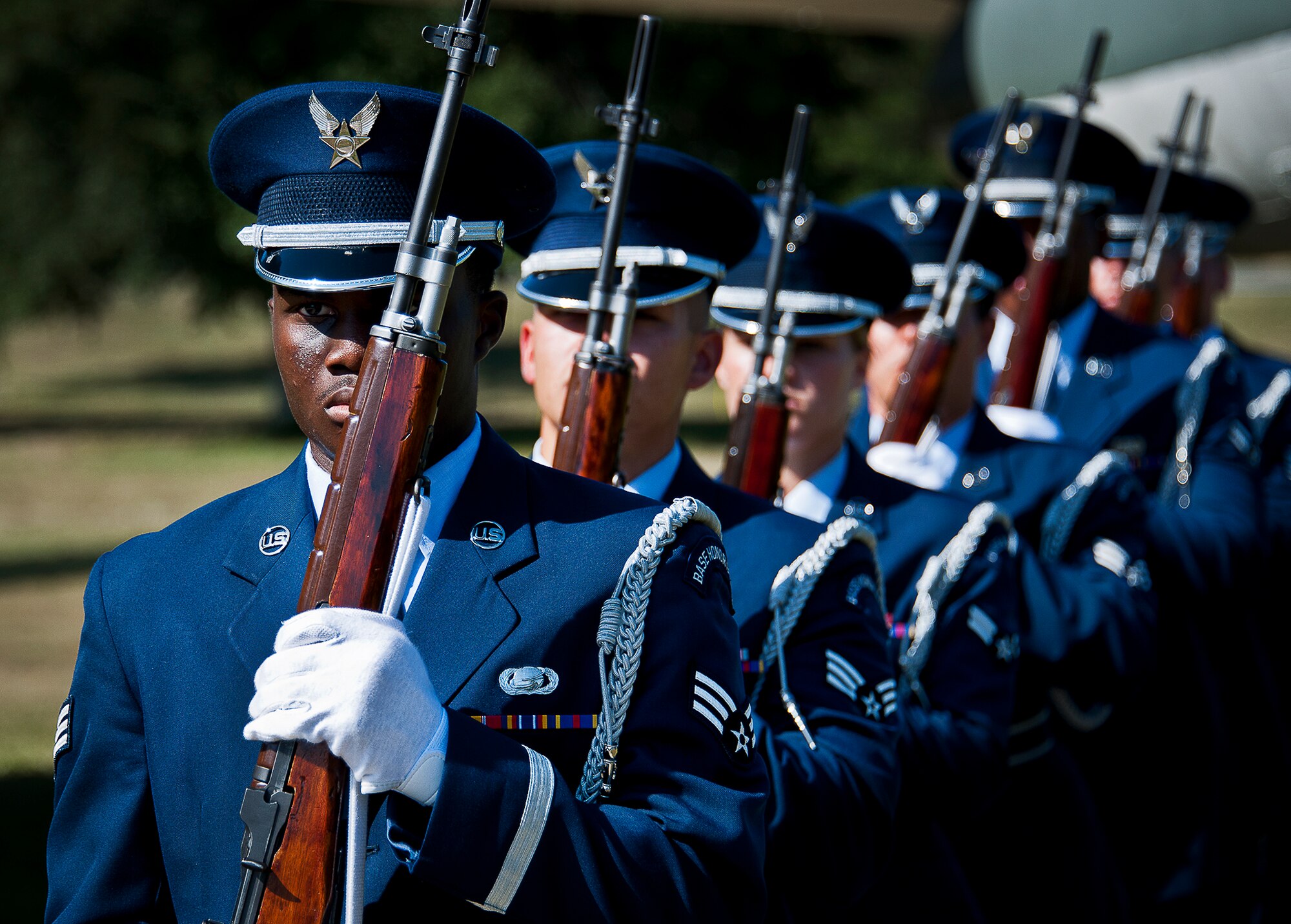 Senior Airman Richard King leads the Team Eglin honor guard rifle volley team away after Eglin’s POW/MIA remembrance ceremony Sept. 20 at the Air Force Armament Museum.  The ceremony paid tribute to those military members who have yet to return home from defending America. The event featured tributes, guest speakers and honor guard procedures. (U.S. Air Force photo/Samuel King Jr.)