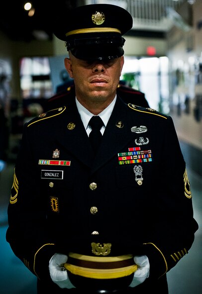 Sgt. 1st Class Anthony Gonzalez, leads the joint service honor guard in to set the POW/MIA remembrance table during Eglin’s POW/MIA remembrance ceremony Sept. 20 at the Air Force Armament Museum.  The ceremony paid tribute to those military members who have yet to return home from defending America. The event featured tributes, guest speakers and honor guard procedures. (U.S. Air Force photo/Samuel King Jr.)