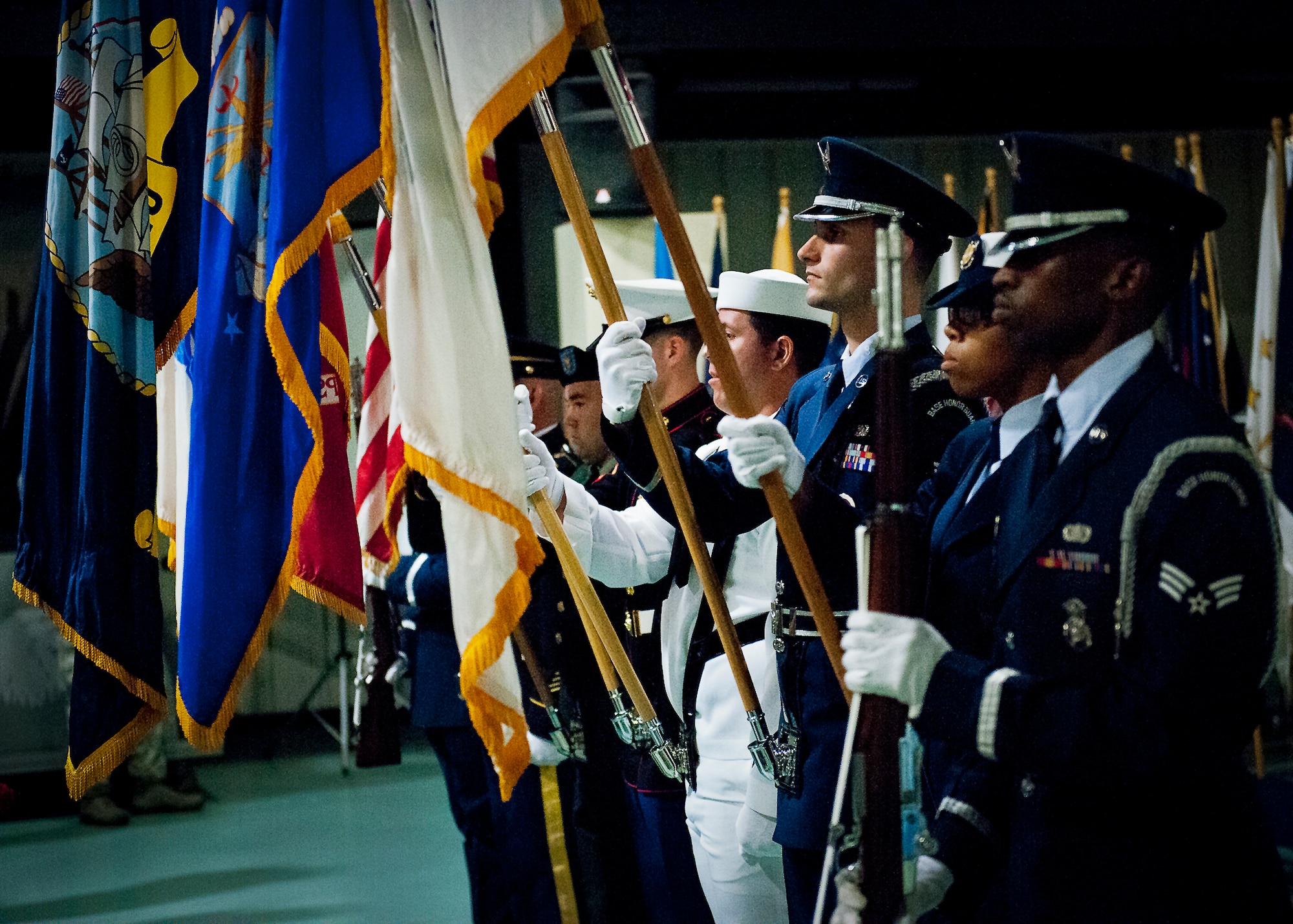 The joint service color guard presents the colors to begin the POW/MIA event Sept. 20 at the Air Force Armament Museum. The ceremony paid tribute to those military members who have yet to return home from defending America. The event featured tributes, guest speakers and honor guard procedures. (U.S. Air Force photo/Samuel King Jr.)