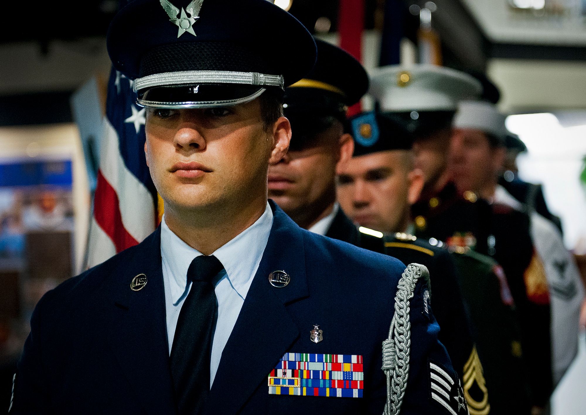 The joint service color guard prepares to present the colors to begin the POW/MIA event Sept. 20 at the Air Force Armament Museum. The ceremony paid tribute to those military members who have yet to return home from defending America. The event featured tributes, guest speakers and honor guard procedures. (U.S. Air Force photo/Samuel King Jr.)