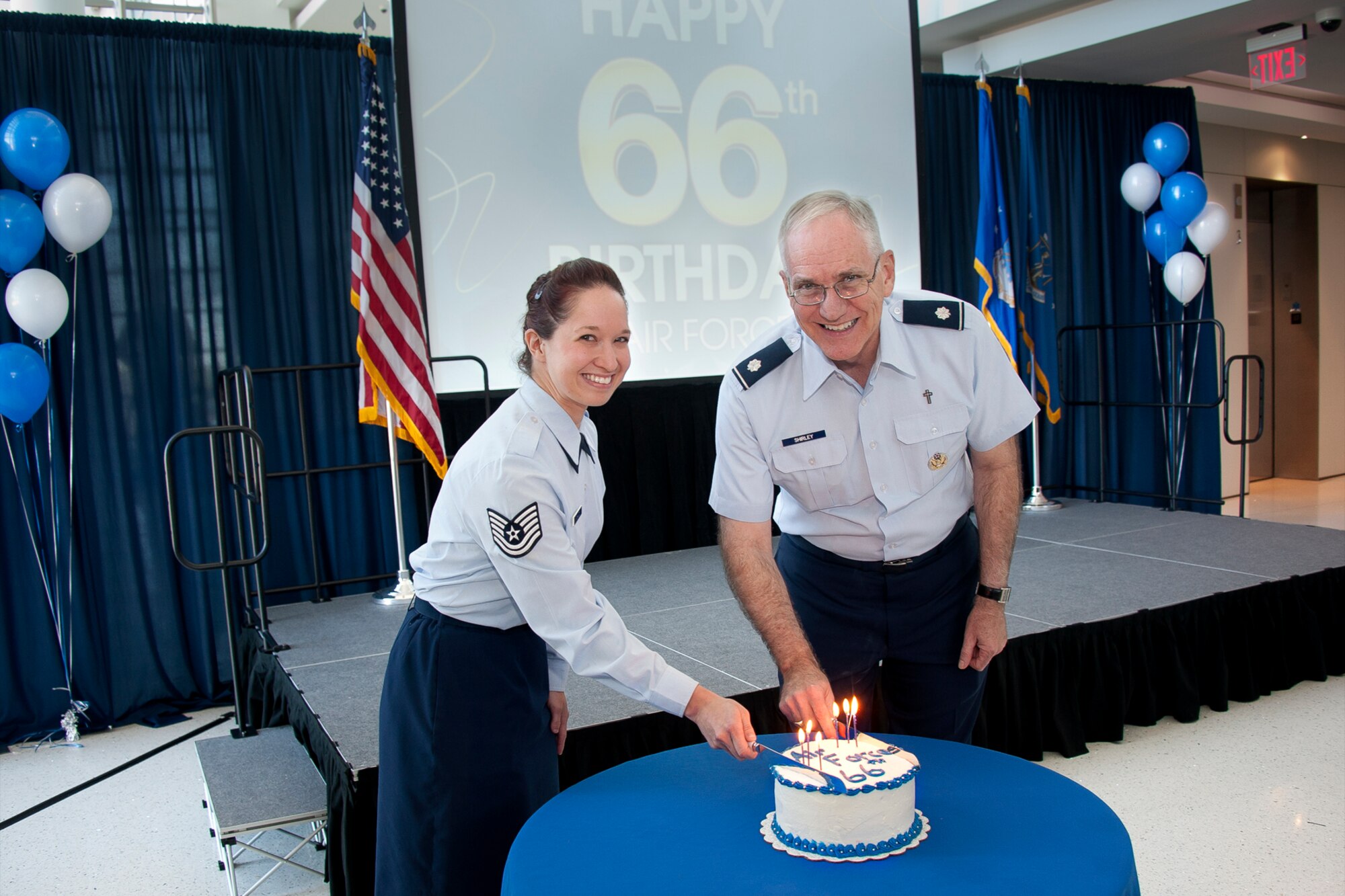 Techical Sgt. Kristin N. Shultz and Lt. Col. Michael A. Shirley, the youngest and oldest airmen assigned to the Air National Guard Readiness Center, Joint Base Andrews, Md., cut a cake to commemorate the 66th birthday of the Air Force, Sept. 17, 2013. In 1947, the National Security Act turned what was then known as the Army Air Corps in the United States Department of the Air Force. (U.S. Air National Guard photo by Master Sgt. Marvin R. Preston/Released)