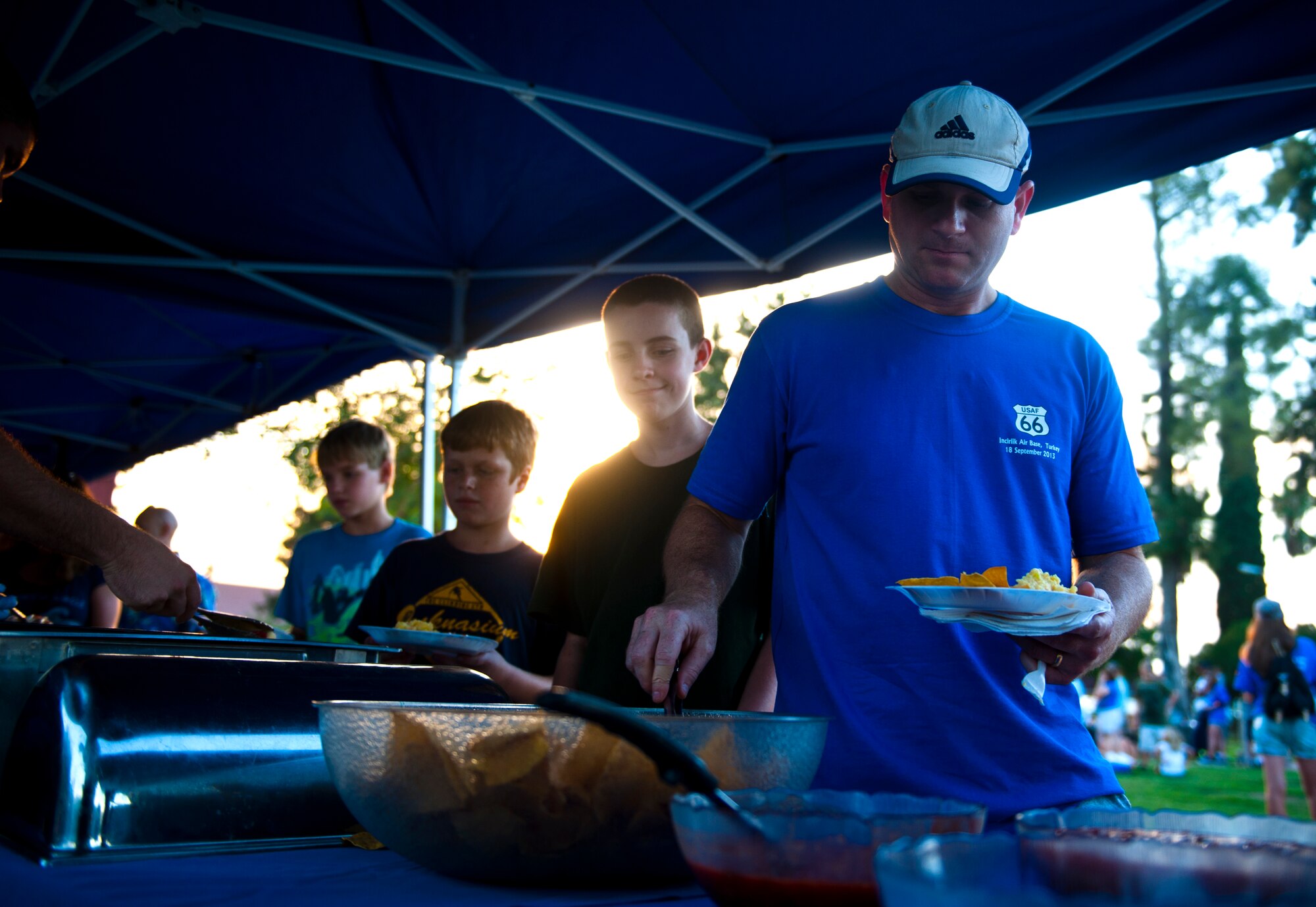 Team Incirlik members place food on their plates during the Air Force Birthday Party Bash at Arkadas Park Sept. 20, 2013, at Incirlik Air Base, Turkey. The Air Force celebrated its 66th birthday Sept. 18. (U.S. Air Force photo by Senior Airman Daniel Phelps/Released)