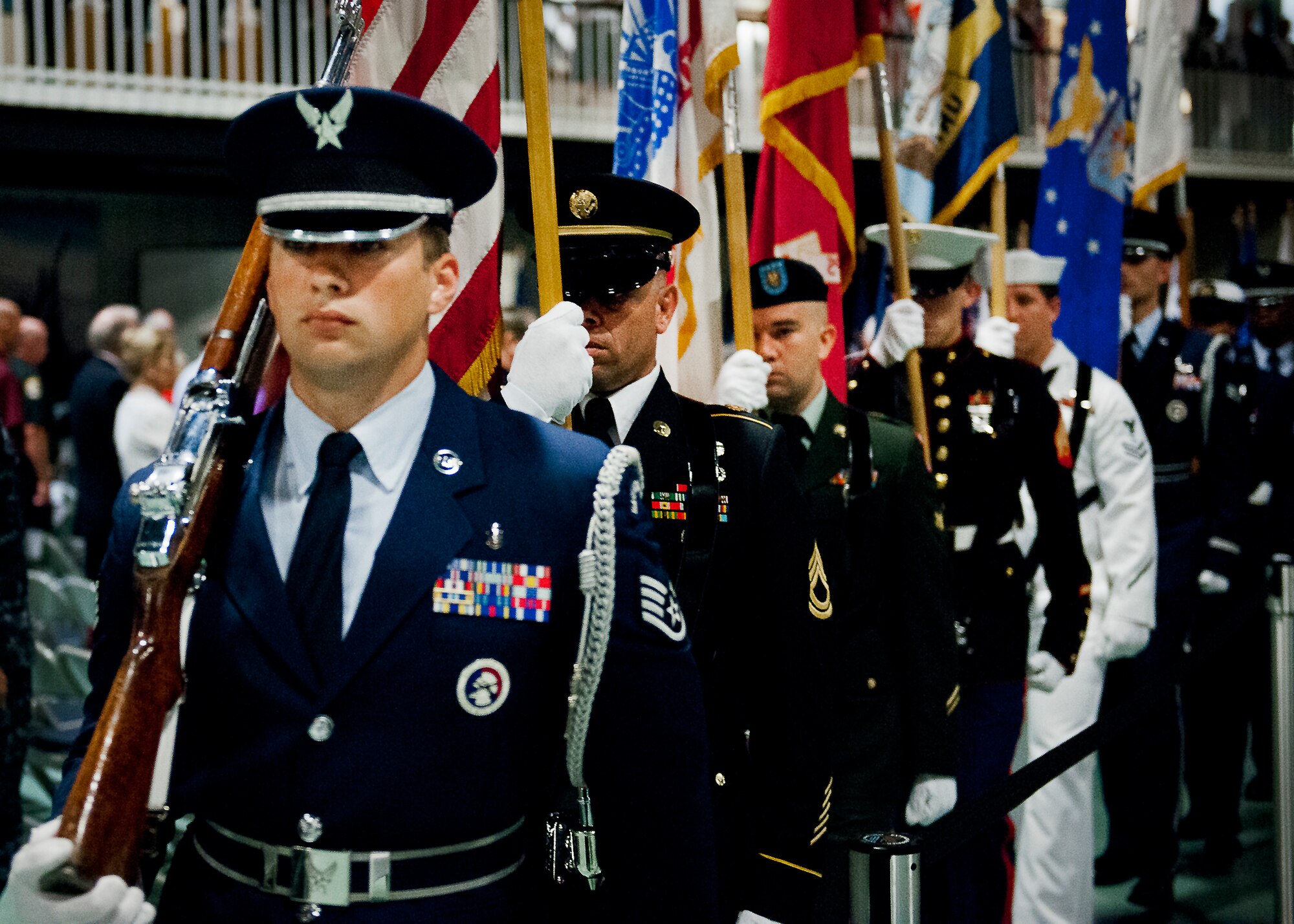 The joint service color guard exits after presenting the colors to begin the POW/MIA event Sept. 20 at the Air Force Armament Museum. The ceremony paid tribute to those military members who have yet to return home from defending America. The event featured tributes, guest speakers and honor guard procedures. (U.S. Air Force photo/Samuel King Jr.)