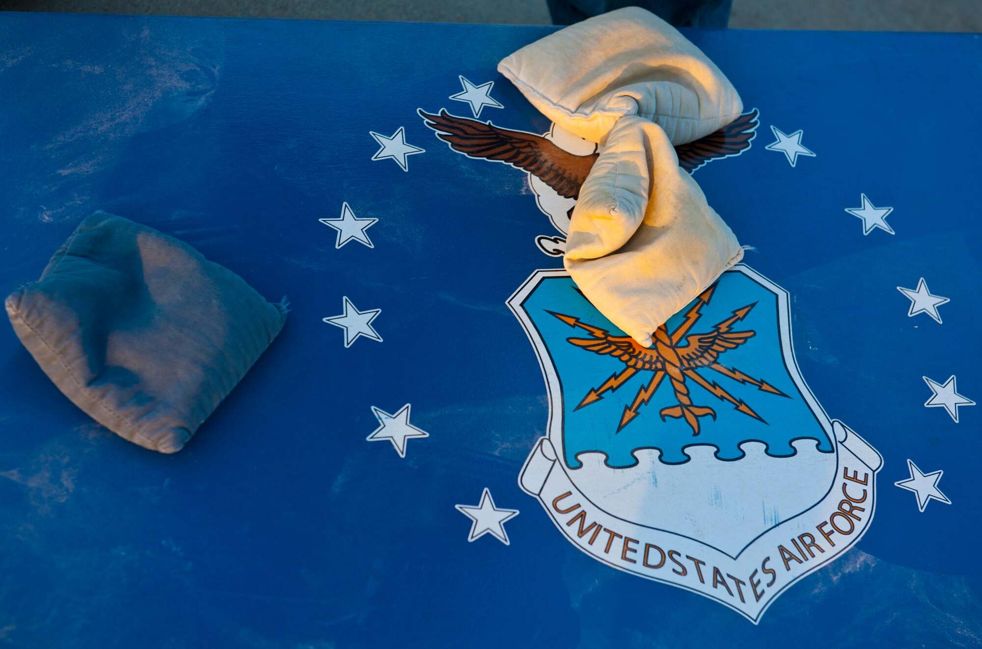 Bean bags sit on a corn-hole board during the Air Force Birthday Party Bash at Arkadas Park Sept. 20, 2013, at Incirlik Air Base, Turkey.  Hundreds of Team Incirlik members celebrated the 66th birthday of the Air Force with games, food and drinks. (U.S. Air Force photo by Senior Airman Daniel Phelps/Released)