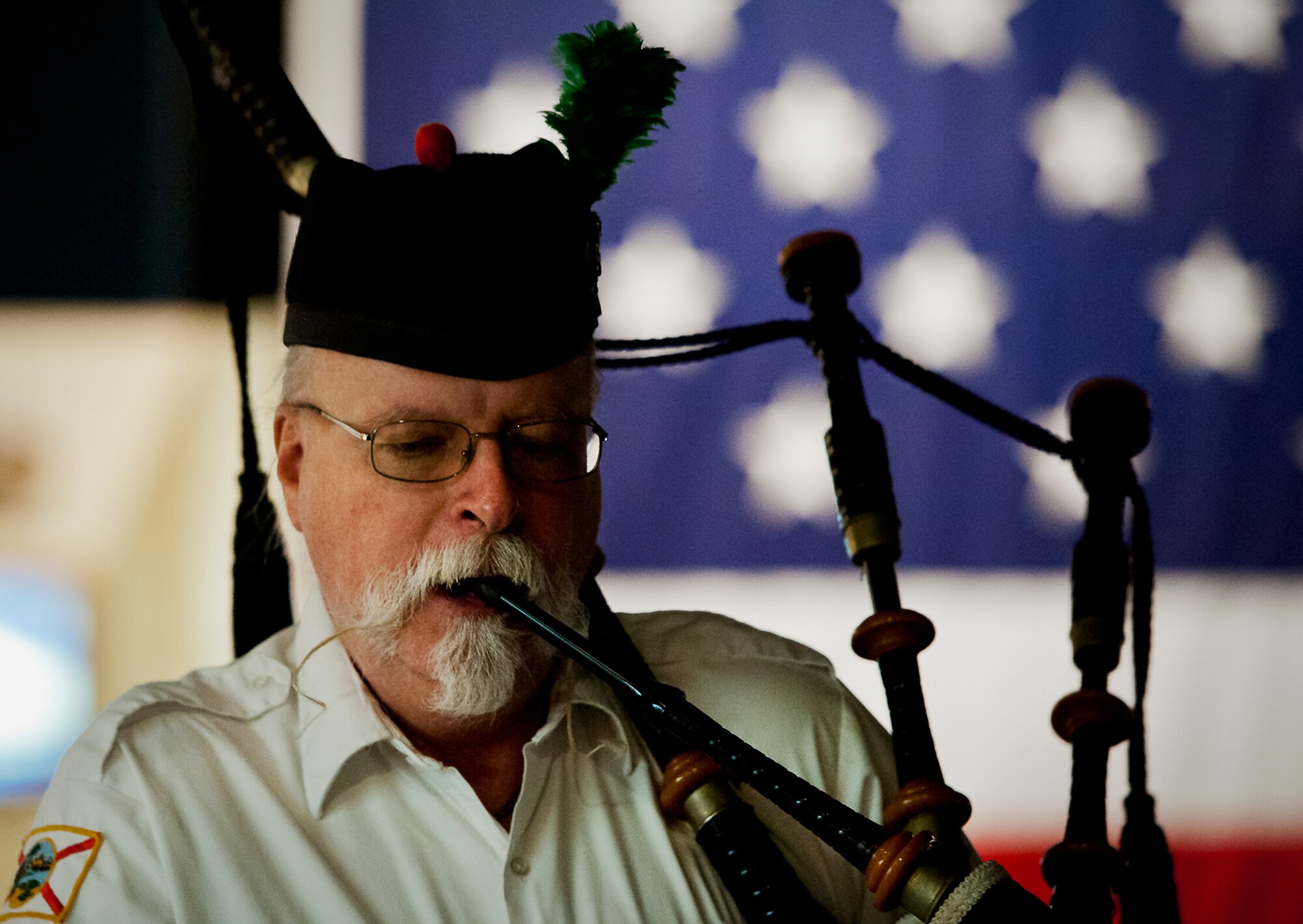 Les Matheson, a retired lieutenant colonel, plays “Amazing Grace” on the bag-pipes during the POW/MIA event Sept. 20 at the Air Force Armament Museum. The ceremony paid tribute to those military members who have yet to return home from defending America. The event featured tributes, guest speakers and honor guard procedures. (U.S. Air Force photo/Samuel King Jr.)