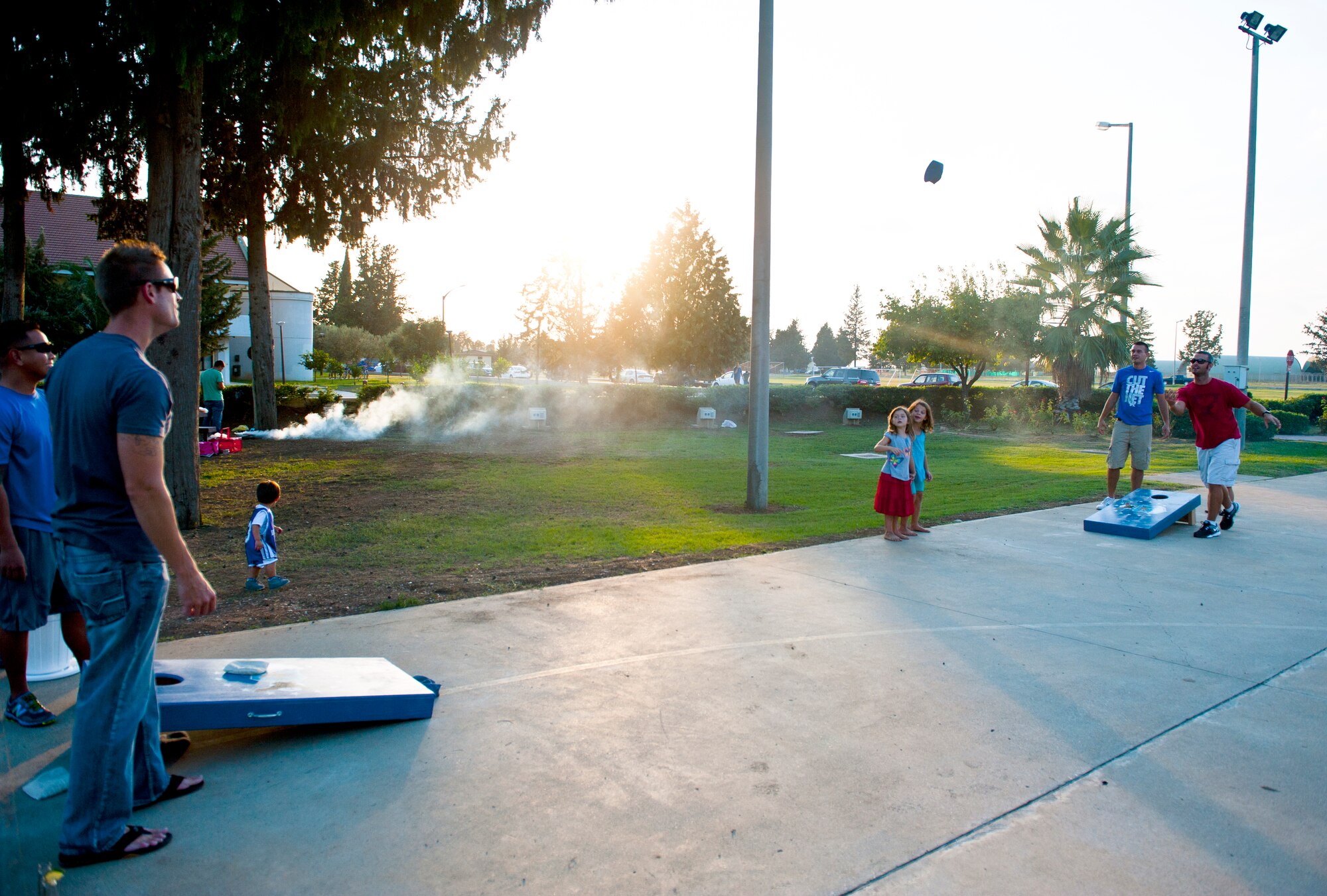 Team Incirlik members play a game of corn hole during the Air Force Birthday Party Bash at Arkadas Park Sept. 20, 2013, at Incirlik Air Base, Turkey. Each year, Air Force installations around- the-world celebrate the birth of the Air Force during the month of September. (U.S. Air Force photo by Senior Airman Daniel Phelps/Released)
