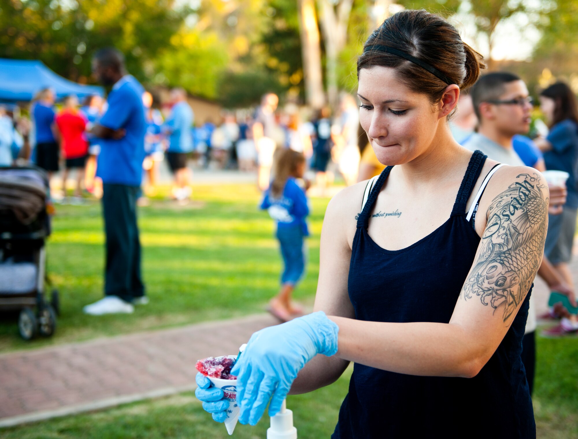 Senior Airman Kaitlyn Hejnes, 39th Medical Operations Squadron dental technician, prepares a snow cone during the Air Force Birthday Party Bash at Arkadas Park Sept. 20, 2013, at Incirlik Air Base, Turkey. Originally part of the U.S. Army, the U.S. Air Force became a separate branch on Sept. 18, 1947.)