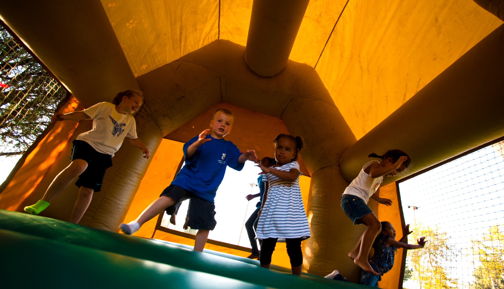 Children play in a bouncy house during the Air Force Birthday Party Bash at Arkadas Park Sept. 20, 2013, at Incirlik Air Base, Turkey.  The Air Force celebrated its 66th birthday Sept. 18, 2013. (U.S. Air Force photo by Senior Airman Daniel Phelps/Released)