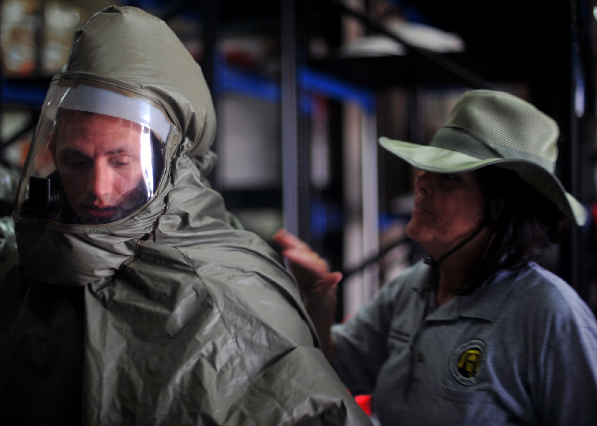 Airman 1st Class Nathan Setzler, 51st Medical Operations Squadron Aerospace Medicine technician, has his powered air-purifying respirator suit checked by Theresa Casey, decontamination instructor and consultant with DECON LLC, during an in-place patient decontamination training course at Osan Air Base, Republic of Korea, Sept. 19, 2013. The training course provided the participants with the skill set needed to respond and process patients through decontamination areas in cases of hazardous material exposure. (U.S. Air Force photo/Senior Airman Siuta B. Ika)