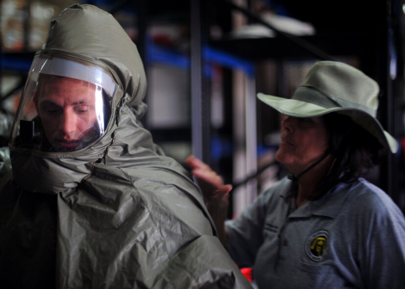 Airman 1st Class Nathan Setzler, 51st Medical Operations Squadron Aerospace Medicine technician, has his powered air-purifying respirator suit checked by Theresa Casey, decontamination instructor and consultant with DECON LLC, during an in-place patient decontamination training course at Osan Air Base, Republic of Korea, Sept. 19, 2013. The training course provided the participants with the skill set needed to respond and process patients through decontamination areas in cases of hazardous material exposure. (U.S. Air Force photo/Senior Airman Siuta B. Ika)
