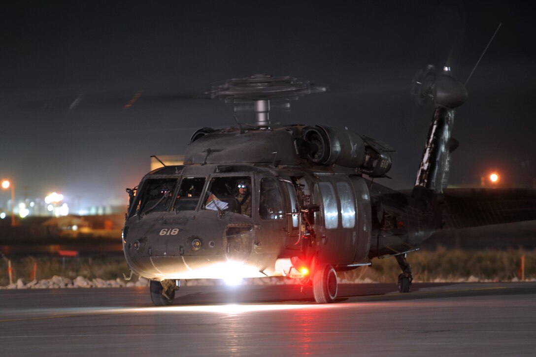 A U.S. Army UH-60L Black Hawk helicopter prepares to taxi to the helicopter landing zone before conducting a personnel movement mission on Bagram Airfield, Afghanistan, Sept. 17, 2013. The helicopter crew is assigned to the 10th Combat Aviation Brigade.