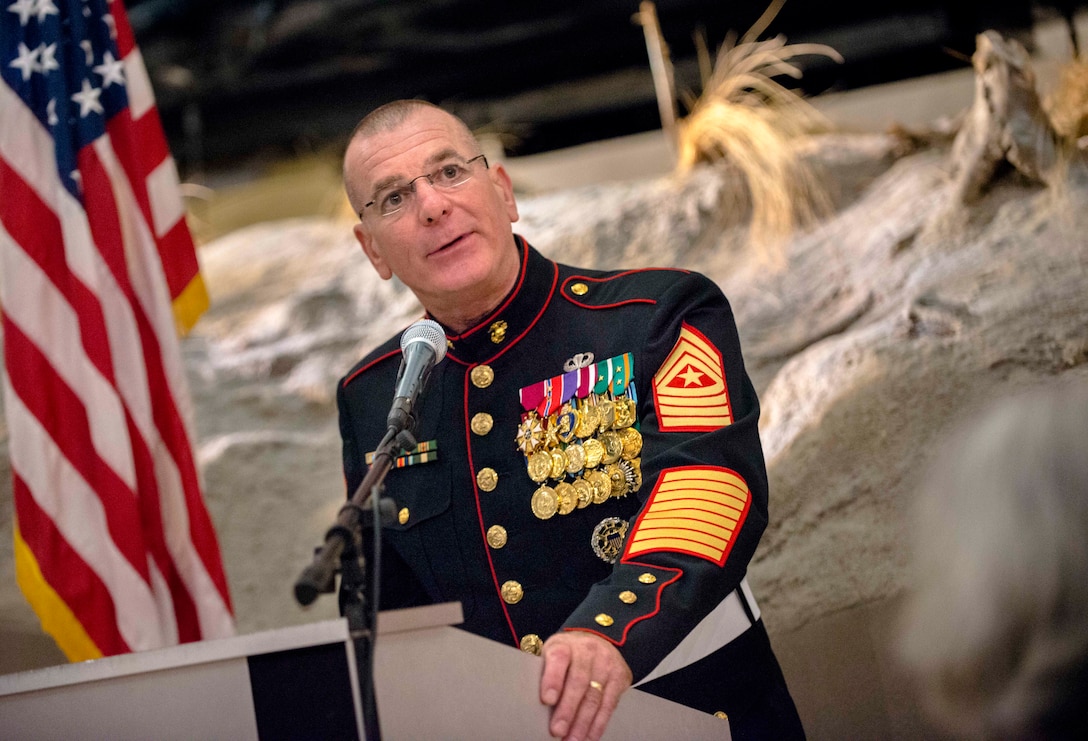 Marine Corps Sgt. Maj. Bryan B. Battaglia, senior enlisted advisor to the chairman of the Joint Chiefs of Staff, delivers remarks during an annual reception and dinner honoring wounded veterans of the wars in Iraq and Afghanistan at the National Museum of the Marine Corps in Triangle, Va., Sept. 21, 2013. The dinner was hosted by the Families of the Wounded Fund, Inc. 