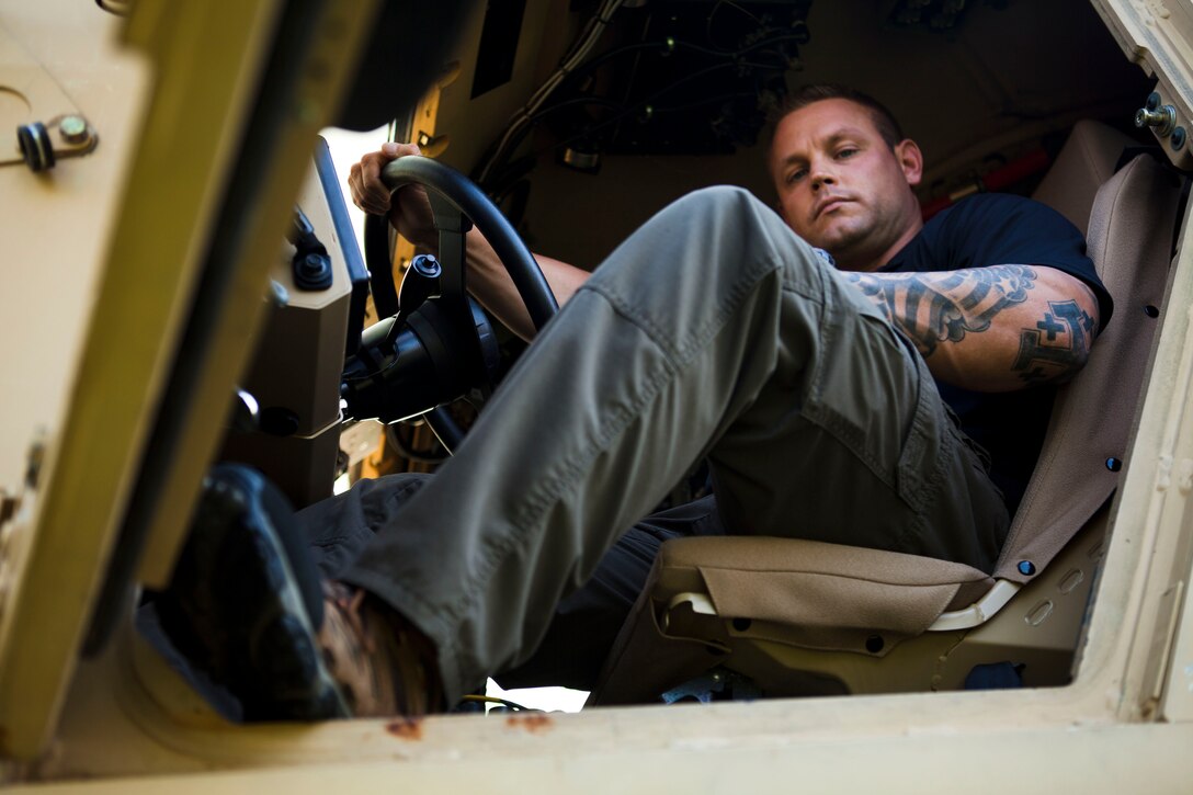Justin Schilling, a logistical management specialist with Naval Surface Warfare Center Dahlgren Division, was wounded in combat in Fallujah, Iraq, and continues to assist those still serving. Schilling deployed to Afghanistan as a government site lead to install and develop upgrades for mine resistant ambush protected vehicles. (U.S. Marine Corps photo by Justin M. Boling)