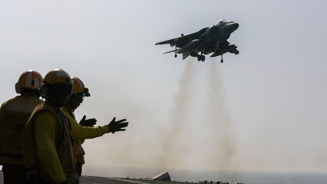 An AV-8B Harrier assigned to Marine Medium Tiltrotor Squadron (VMM) 266 (Reinforced), 26th Marine Expeditionary Unit (MEU), lands on the flight deck of the USS Kearsarge (LHD 3), at sea, Sept. 24, 2013. The 26th MEU is a Marine Air-Ground Task Force forward-deployed to the U.S. 5th and 6th Fleet areas of responsibility aboard the Kearsarge Amphibious Ready Group serving as a sea-based, expeditionary crisis response force capable of conducting amphibious operations across the full range of military operations.  (U.S. Marine Corps photo by Sgt. Christopher Q. Stone, 26th MEU Combat Camera/Released)