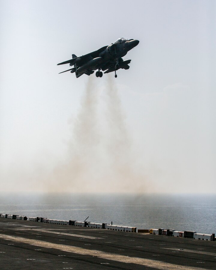 An AV-8B Harrier assigned to Marine Medium Tiltrotor Squadron (VMM) 266 (Reinforced), 26th Marine Expeditionary Unit (MEU), lands on the flight deck of the USS Kearsarge (LHD 3), at sea, Sept. 24, 2013. The 26th MEU is a Marine Air-Ground Task Force forward-deployed to the U.S. 5th and 6th Fleet areas of responsibility aboard the Kearsarge Amphibious Ready Group serving as a sea-based, expeditionary crisis response force capable of conducting amphibious operations across the full range of military operations.  (U.S. Marine Corps photo by Sgt. Christopher Q. Stone, 26th MEU Combat Camera/Released)