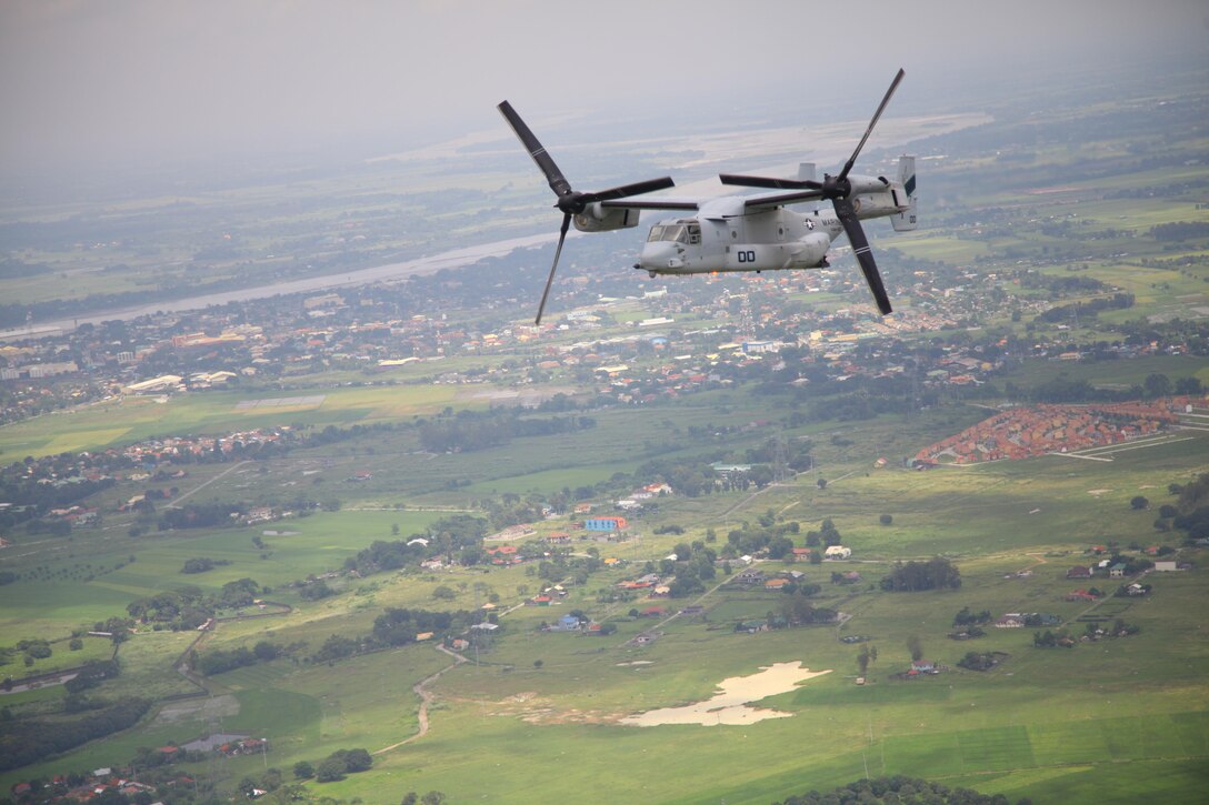 An MV-22B Osprey conducts a site-survey mission over Pampanga, Republic of the Philippines, Sept. 17 as part of Amphibious Landing Exercise 2014. The recurrence of PHIBLEX, now in its 30th year, demonstrates the U.S. and Republic of the Philippines' commitment to mutual security and their long-time partnership. The Osprey is with Marine Medium Tiltrotor Squadron 166, part of the 13th Marine Expeditionary Unit's aviation combat element.