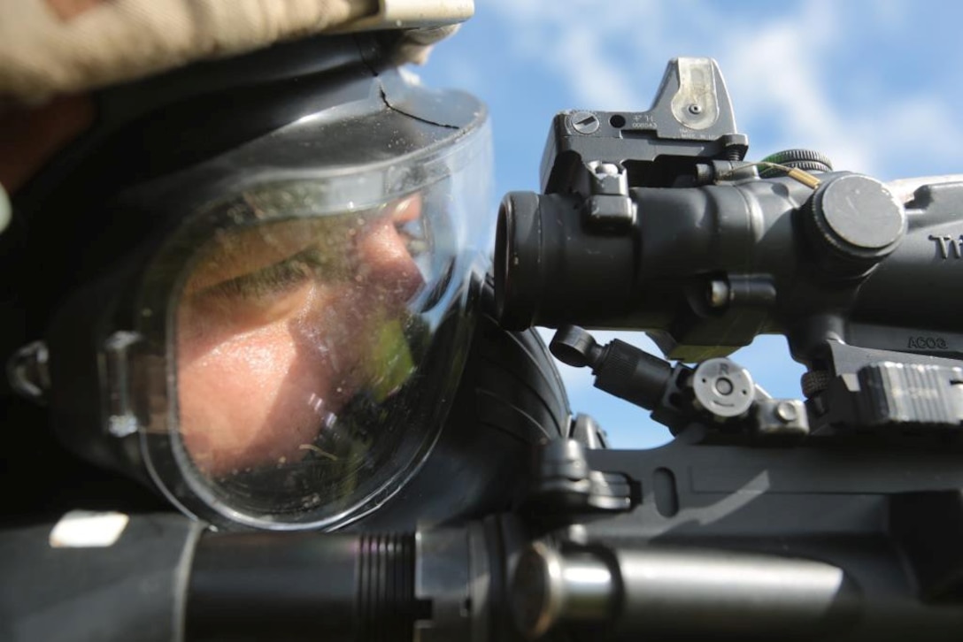 Lance Cpl. Tylan S. Kang, an Infantry Automatic Rifle Gunner with 1st squad, 2nd Platoon, Bravo Company, Battalion Landing Team 1/4, 13th Marine Expeditionary Unit and Laguna Beach, Calif., native conducts a tactical reload during a competition shoot aboard Naval Base Guam, Guam Sept. 12, 2013. Marines and Sailors with 13th MEU will deploy for several months in support of theater requirements of Geographic Combatant Commanders. (Official U.S. Marine Corps photo by Sgt. Christopher O'Quin/Released)