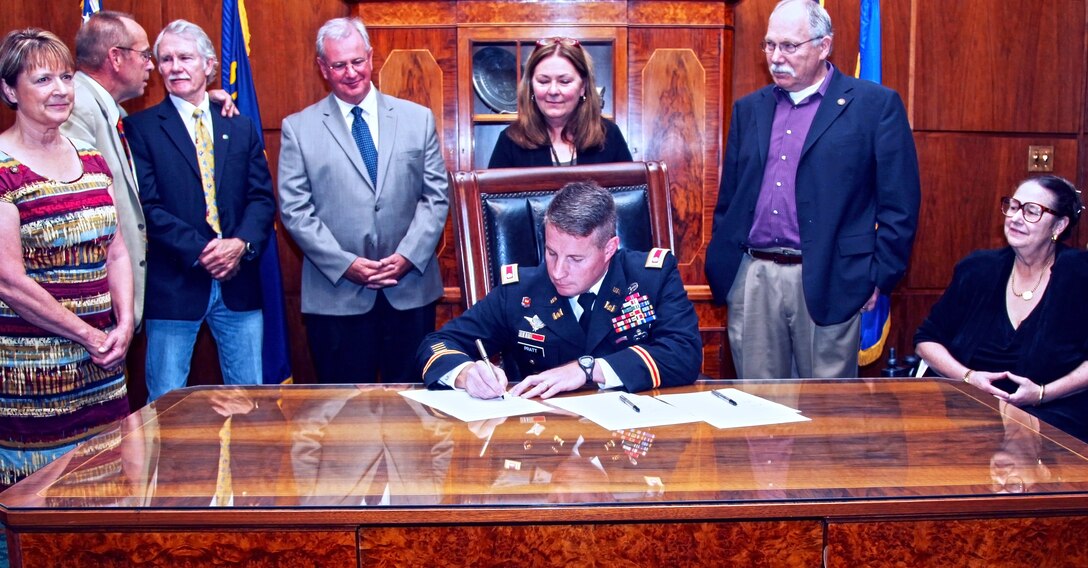 Lt. Col. Glenn Pratt, deputy district commander, signs a Declaration of Cooperation at the state capital Sept. 17, to maintain the federal navigation channels on Oregon’s coast. State Senator Jeff Kruse, second from left, and Gov. John Kitzhaber, next to Kruse, also signed the document. 

From far left is Rep. Caddy McKeown, Coos Bay; State Senator Jeff Kruse; Governor John Kitzhaber; Rep. David Gomberg, Lincoln City/Neotsu; Rep. Deborah Boone, Cannon Beach; Sen. Arnie Roblan, Coos Bay; & State Senator Betsy Johnson.