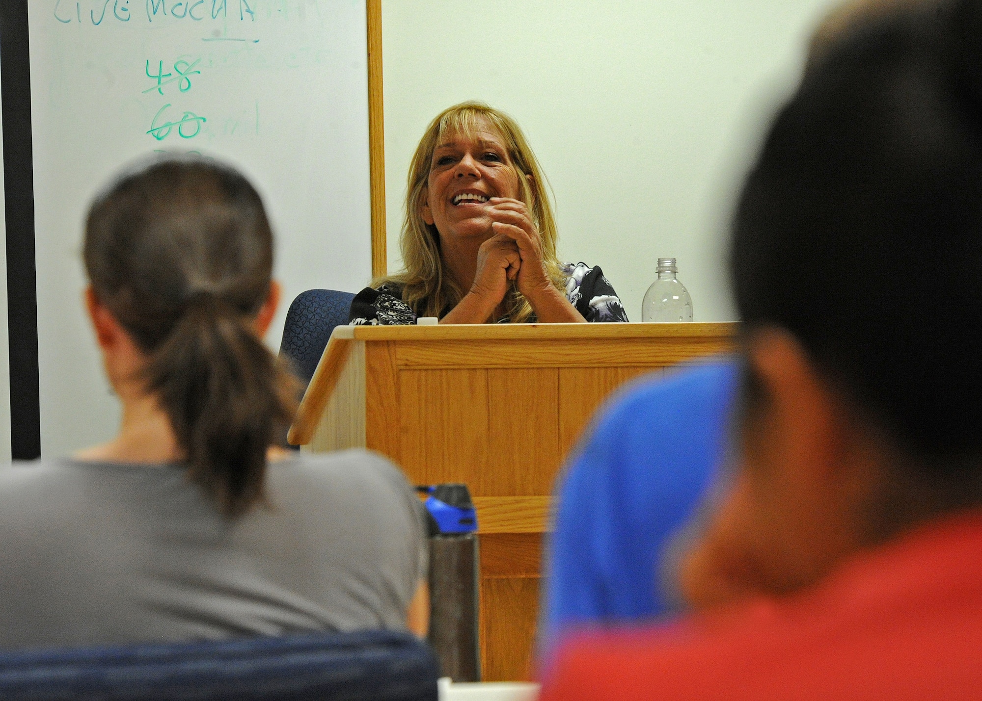 Mrs. Debra Blunt, a 19-year accredited financial counselor and 20-year military spouse teaches the Million Dollar Sailor/Airman course to a group of servicemembers and their spouses at the Military and Family Support Center at Joint Base Pearl Habor-Hickam, Hawaii, Sept. 18, 2013. Blunt was a creator of the course which originated in Hawaii.  The program was the first of its kind and has since spread Navy-wide.  (U.S. Air Force photo/Tech. Sgt. Jerome S. Tayborn)