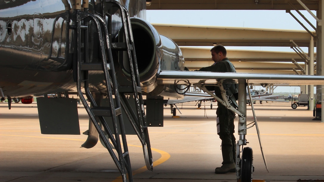 1st Lt Rob Hansen, 80th Flying Training Wing graduate pilot, Euro NATO Joint Jet Pilot Training Program, Sheppard Air Force Base, Texas, does a pre-flight inspection of the T-38 Talon after he beat a bout of Hodgkin’s lymphoma caner. He spent 16 months fighting to get back in the program after his diagnosis. Upon graduation, he was awarded as a distinguished graduate for scoring in the top 10 percent of the class; the Daedalian Award for top formation pilot; the Flying Excellence award for the top overall flying score, and the Commander’s Trophy for being the top graduate. He was awarded the F-22 Raptor. (U.S Air Force photo courtesy photo)