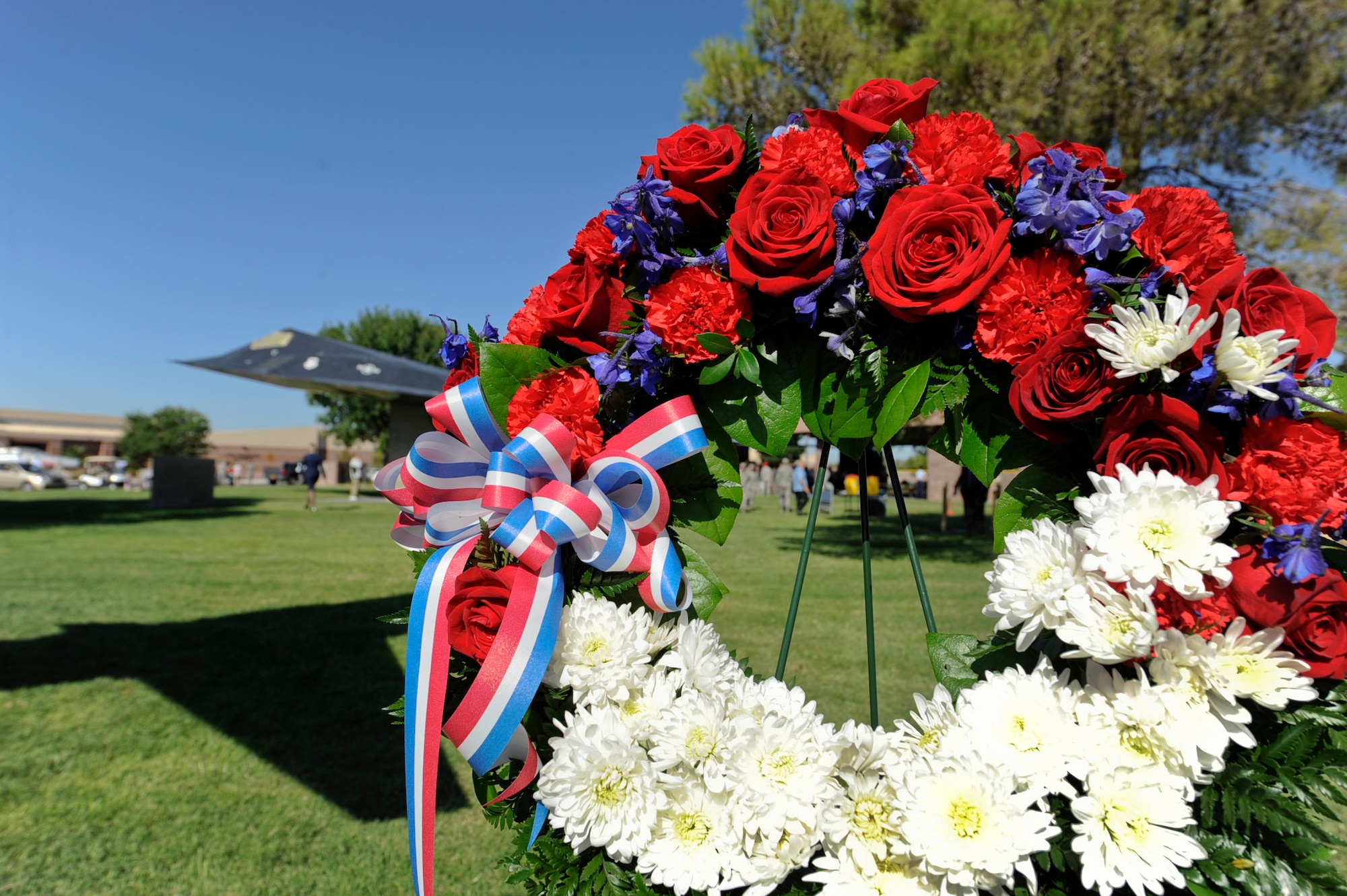 A memorial wreath is displayed during the National Prisoner of War/Missing in Action Remembrance ceremony at Freedom Park Sept. 20, 2013, at Nellis Air Force Base, Nev. Cadets from the Rancho High School Air Force Junior ROTC placed daisies on the memorial wreath and Nellis AFB Airmen read the names of the deceased prisoners of war from Nevada. (U.S. Air Force photo by Lorenz Crespo)