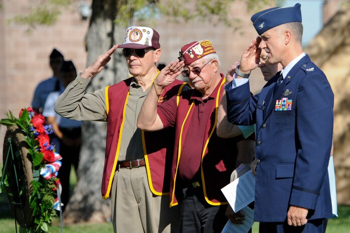 From left, Carroll Knutson, Gene Ramos, Jack Leaming, former prisoners of war, and Col. Pete Ford, 57th Adversary Tactics Group commander and guest speaker, render a salute during the National Prisoner of War/Missing in Action Recognition Day ceremony Sept. 20, 2013, at Nellis Air Force Base, Nev. POW/MIA observance is traditionally observed on the third Friday of September each year. (U.S. Air Force photo by Lorenz Crespo)