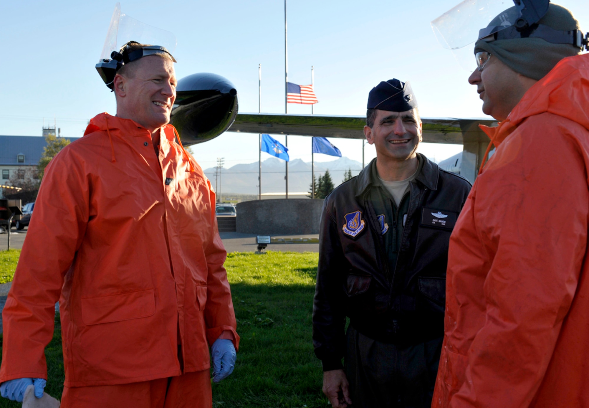 Air Force Col. David Nahom, 3rd Wing commander, and Air Force Col. Michael Grismer, 3rd Wing vice commander, speak with Air Force Lt. Col. Jesus Ramos, 3rd Maintenance Squadron commander, at Heritage Park during the static aircraft cleaning on Joint Base Elmendorf-Richardson, Sept. 20. The 3rd Wing Aircraft Structural Maintenance Shop, Fabrication Flight, washes the static aircraft twice a year for inspections to determine if repairs or paint jobs are necessary. (U.S. Air Force photo/Airman 1st Class Tammie Ramsouer)