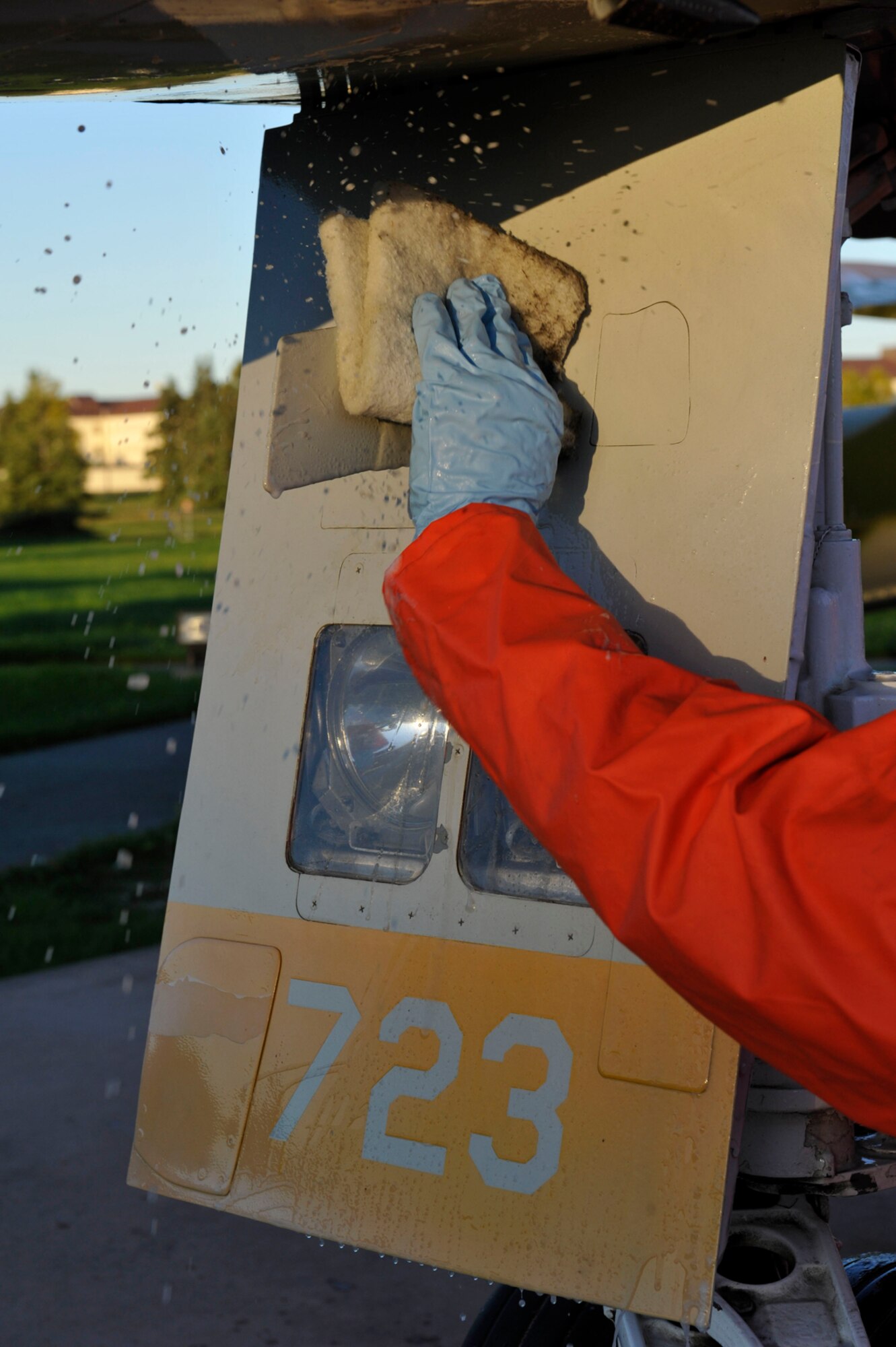 Air Force Lt. Col. Jesus Ramos, 3rd Maintenance Squadron commander, washes an F-4 Phantom during a bi-annual static aircraft cleaning on Joint Base Elmendorf-Richardson, Sept. 20. The cleaning keeps the airplanes free of dirt and debris for an annual inspection for corrosion. (U.S. Air Force photo/Airman 1st Class Tammie Ramsouer)