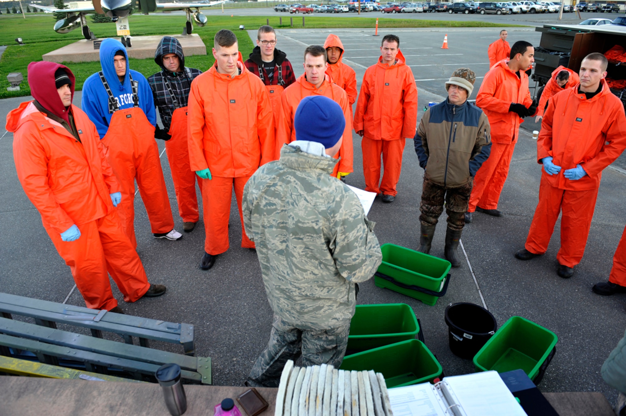 Air Force Airman 1st Class Kyle Snyder, 3rd Maintenance Squadron aircraft structural maintainer, briefs members from the 3rd Wing's Aircraft Structural Maintenance Shop during the bi-annual static aircraft cleaning on Joint Base Elmendorf-Richardson, Sept. 20. The cleaning is mandatory for the 3rd Wing to keep the aircraft free of debris and to inspect for corrosion. (U.S. Air Force photo/Airman 1st Class Tammie Ramsouer)