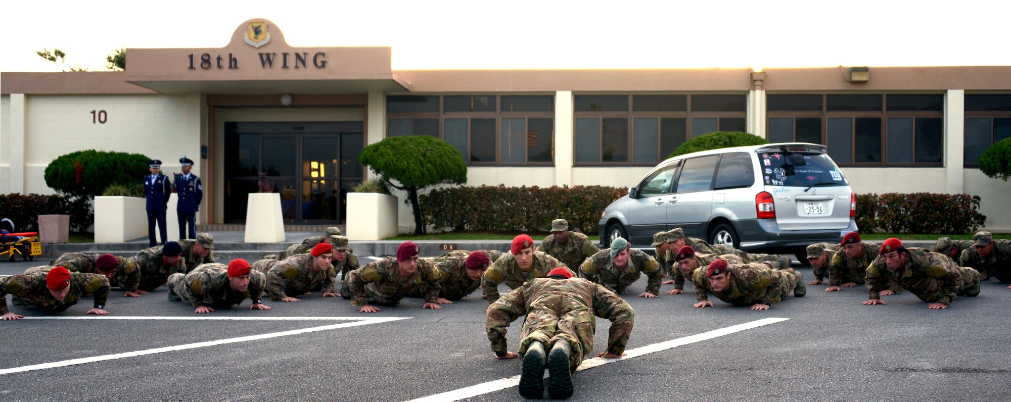 Members from the 320th Special Tactics Squadron perform memorial pushups to honor their fallen comrades after the National POW/MIA flag ceremony held Sept. 20, 2013 at Kadena Air Base, Japan. National POW/MIA Recognition day is held the third Friday in September every year to honor more than 70,000 POW/MIA personnel.  (U.S. Air Force by Tech. Sgt. Kristine Dreyer)
