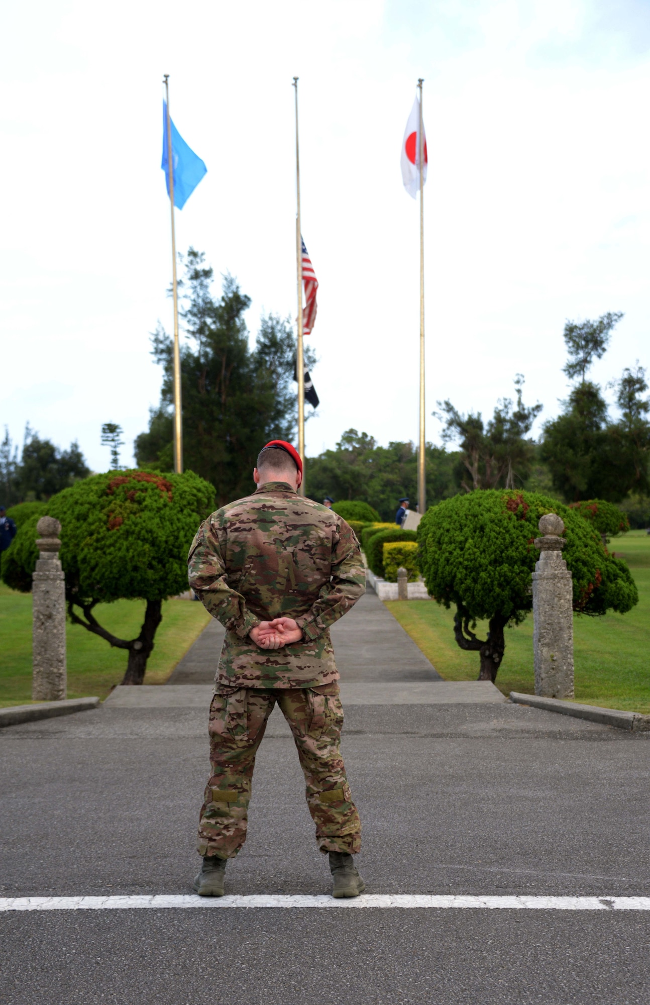 Maj. William White, 320th Special Tactics Squadron commander, bows his head during the innovocation at the POW/MIA flag ceremony held Sept. 20, 2013 at Kadena Air Base, Japan.  The flag ceremony signified the end of the 24-hour vigil run held to honor more than 70,000 POW and MIA personnel.  (U.S. Air Force photo by Tech. Sgt. Kristine Dreyer)