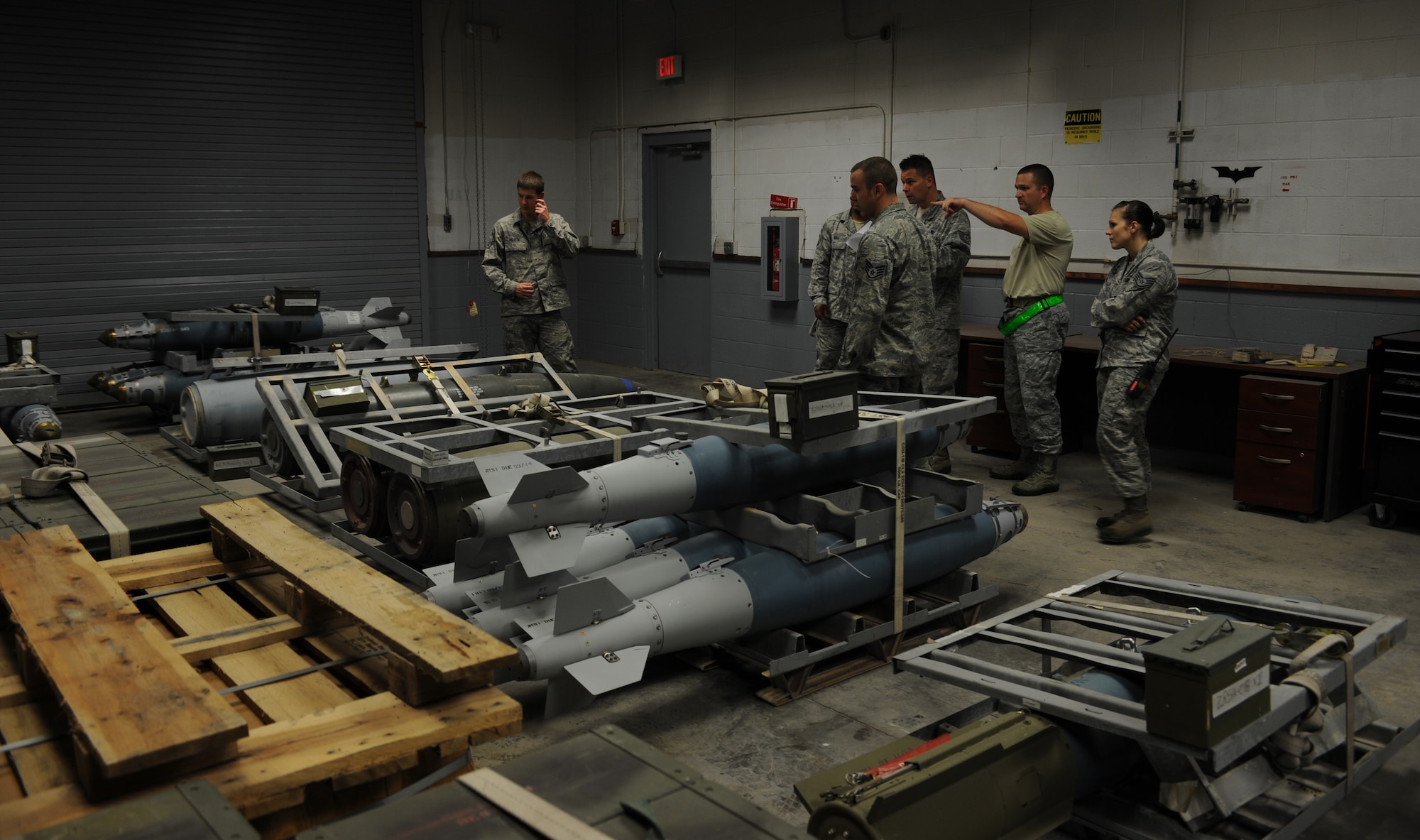 Members of the 366th Equipment Maintenance Squadron perform a 100 percent inventory Sept. 3, 2013, at Mountain Home Air Force Base, Idaho. Each munitions asset is physically checked to ensure it's in the proper location and still in working condition. (U.S. Air Force photo by Senior Airman Benjamin Sutton/Released)