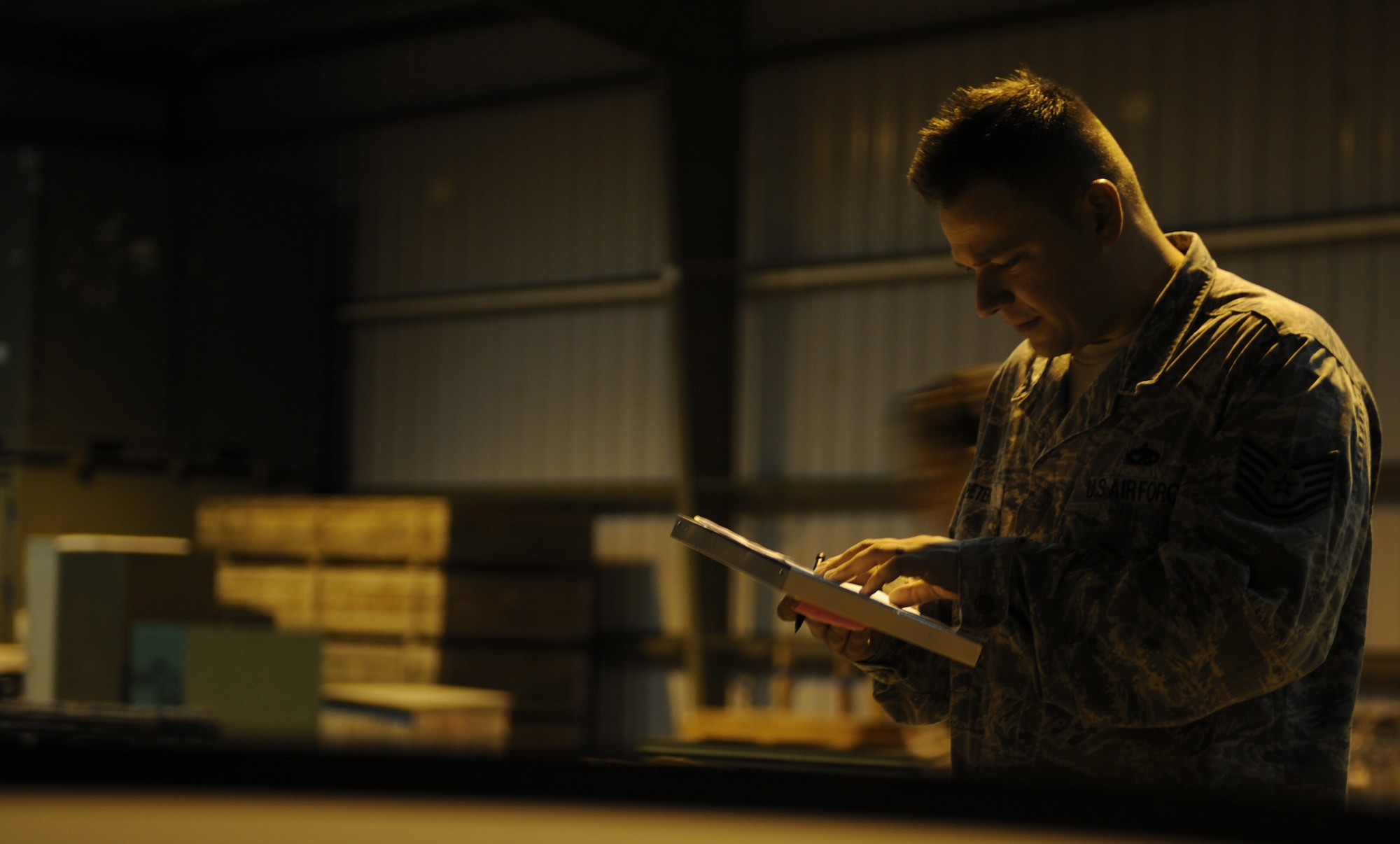 U.S. Air Force Tech. Sgt. Michael Pieters, 366th Equipment Maintenance Squadron production supervisor, double checks his inventory count Sept. 3, 2013, at Mountain Home Air Force Base, Idaho. Ammo personnel were involved in the entire inventory process from pre-inventory inspections to the location validations throughout more than 20 buildings. (U.S. Air Force photo by Senior Airman Benjamin Sutton/Released)