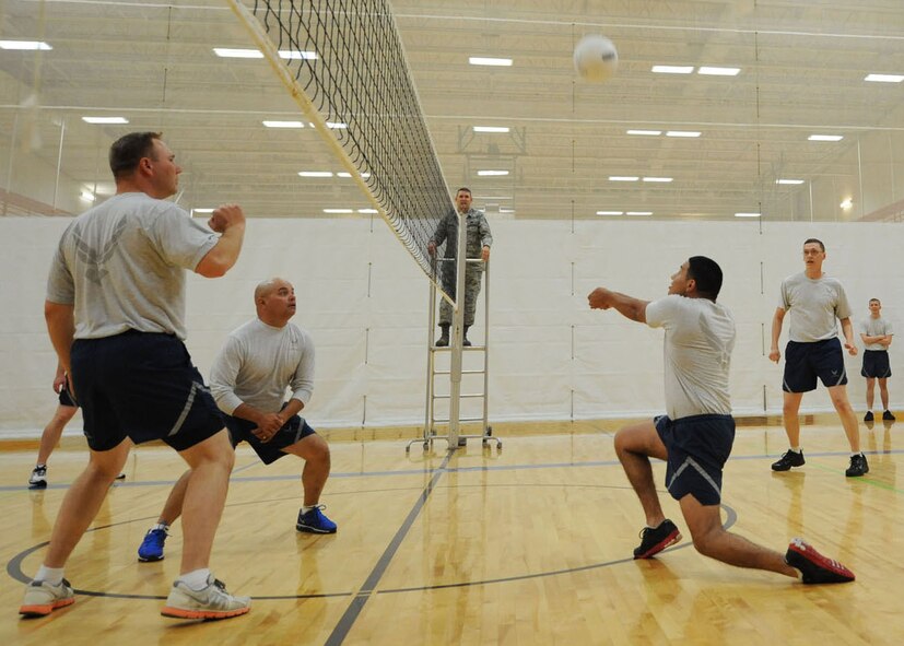 Senior Airman Javi Ortiz, 28th Maintenance Squadron weapons loader, sets up a volley during a volleyball game against base leadership in the Bellamy Fitness Center at Ellsworth Air Force Base, S.D., Sept. 17, 2013. Base leadership defended their title as Ellsworth’s reigning champions during ALS volleyball games, sweeping the tournament 3-0. (U.S. Air Force photo by Airman 1st Class Rebecca Imwalle / Released)