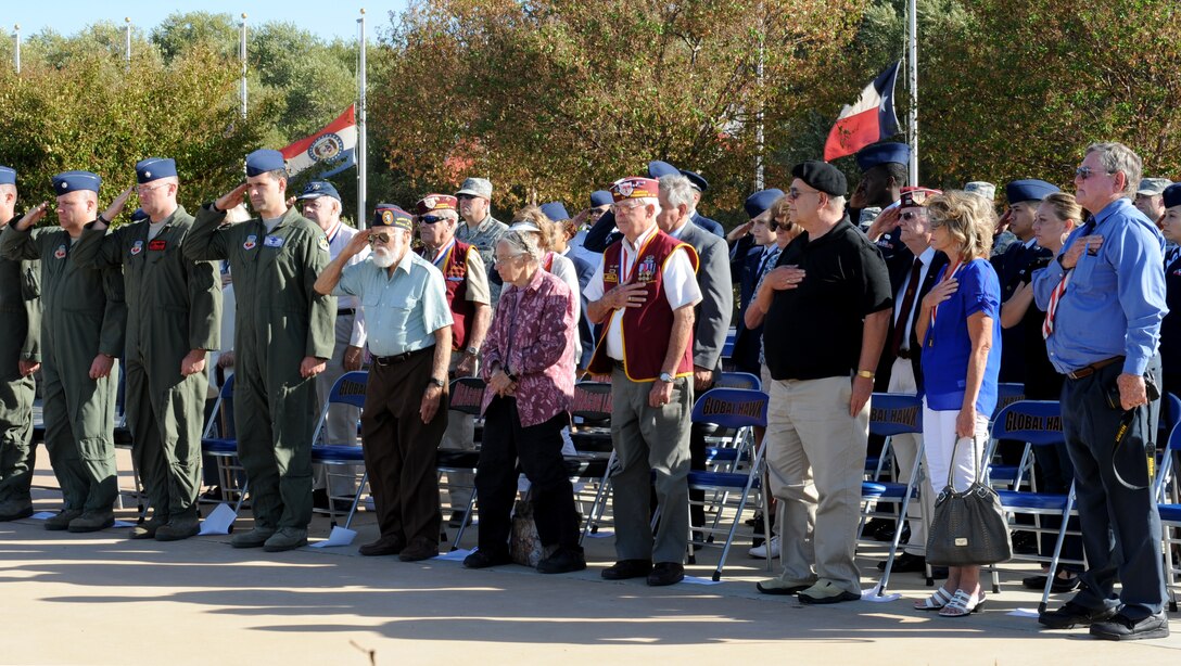 Team Beale and former Prisoners of War salute during a POW/MIA roll call at Heritage Park on Beale Air Force Base, Calif., Sept. 20, 2013. The U.S. National POW/MIA Recognition Day is observed the third Friday of September. (U.S. Air Force photo by Staff Sgt. Robert M. Trujillo/Released)