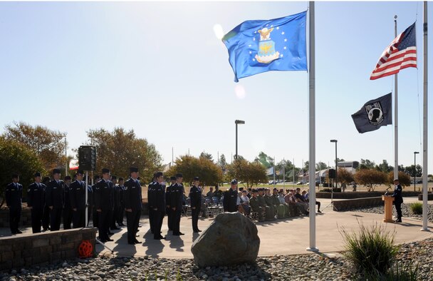 Team Beale gathers to honor America’s Prisoners of War and those still Missing in Action during a POW/MIA ceremony at Heritage Park on Beale Air Force Base, Calif., Sept. 20, 2013. Several former POWs attended the event, to including guest speaker Vietnam veteran Mike O’Connor, a helicopter pilot who spent 1,857 days in captivity. (U.S. Air Force photo by Staff Sgt. Robert M. Trujillo/Released)