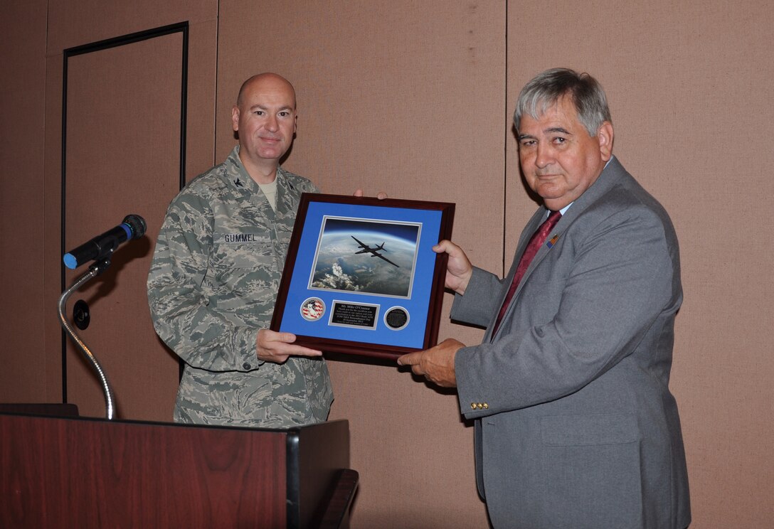 Col. Quinn Gummel, 9th Reconnaissance Wing vice commander, presents Mike O’Connor with a recognition plaque during a POW/MIA breakfast at the Recce Point Club on Beale Air Force Base, Calif., Sept. 20, 2013. O’Connor spent 1,857 days as a POW during the Vietnam War. (U.S. Air Force photo by Staff Sgt. Robert M. Trujillo/Released)