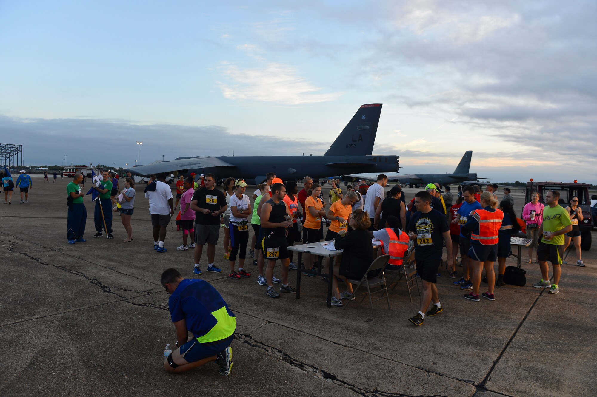 Participants of the Barksdale Half Marathon and 5k sign in prior to the run on Barksdale Air Force Base, La., Sept. 21, 2013. After signing in, runners were able to get a close look at B-52H Stratofortress bombers, Emergency Ordnance Disposal equipment and fire equipment before the start of the race. (U.S. Air Force photo/Senior Airman Micaiah Anthony)
