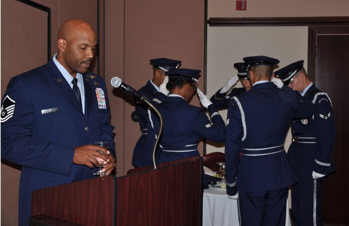 Master Sgt. Illyas reads a toast to honor America’s Prisoners of War and those still Missing in Action during a POW/MIA breakfast at the Recce Point Club on Beale Air Force Base, Calif., Sept. 20, 2013. The U.S. National POW/MIA Recognition Day is observed the third Friday of September. (U.S. Air Force photo by Staff Sgt. Robert M. Trujillo/Released)
