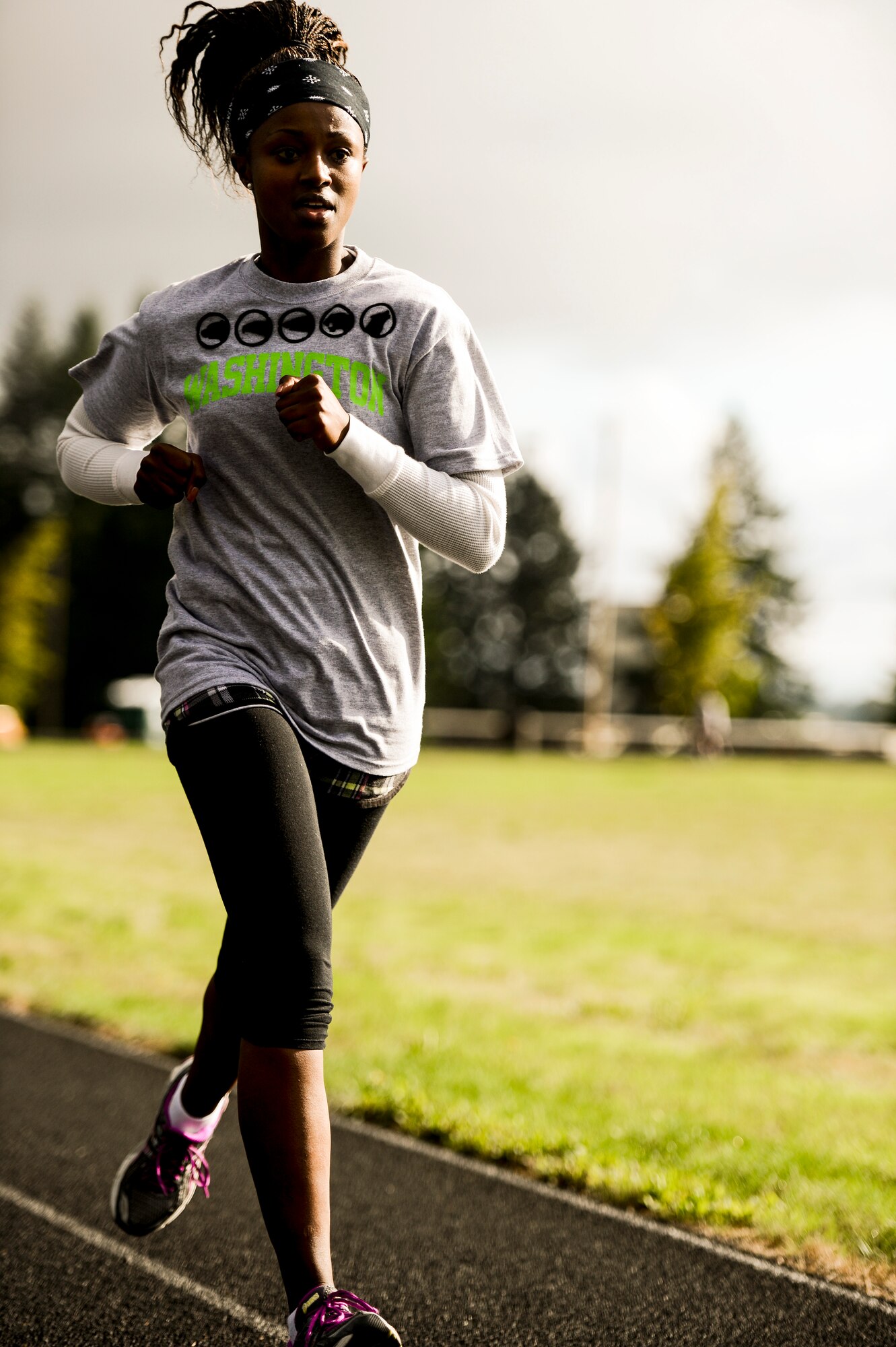 Staff Sgt. Linette Nosim, 627th Logistics Readiness Squadron integrated receiving supervisor, jogs in the early morning sun, Sept. 18, 2013, at the McChord running track at Joint Base Lewis-McChord, Wash. Nosim was one of the many McChord Airmen who participated in the 24-hour POW/MIA run. (U.S. Air Force photo/Tech. Sgt. Sean Tobin)