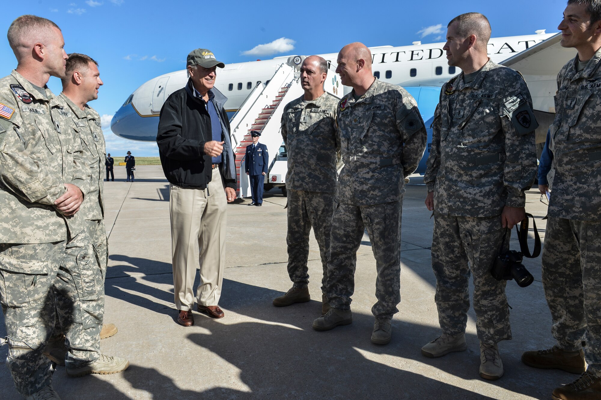 Vice President Joe Biden speaks with Colorado Army National Guard Aviation Support Facility members Sept. 23, 2013, at Buckley Air Force Base, Colo. Biden visited Colorado to view the damage and survey recovery efforts after the flooding that killed at least eight people and ravaged at least 14 counties. (U.S. Air Force photo by Airman 1st Class Riley Johnson/Released)