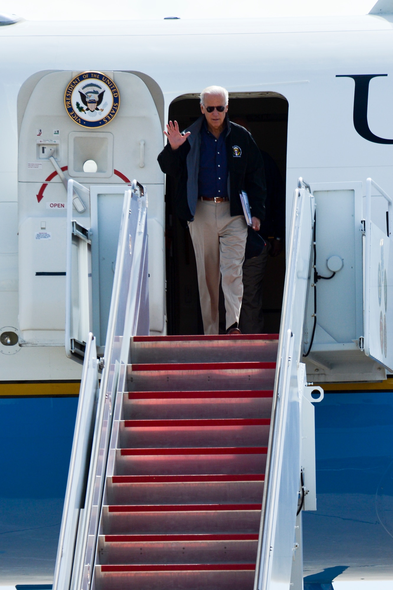 Vice President Joe Biden waves to the crowd as he deplanes Air Force Two Sept. 23, 2013, at Buckley Air Force Base, Colo. Biden visited Colorado to view the damage and survey recovery efforts after the flooding that killed at least eight people and ravaged at least 14 counties. (U.S. Air Force photo by Airman 1st Class Riley Johnson/Released)