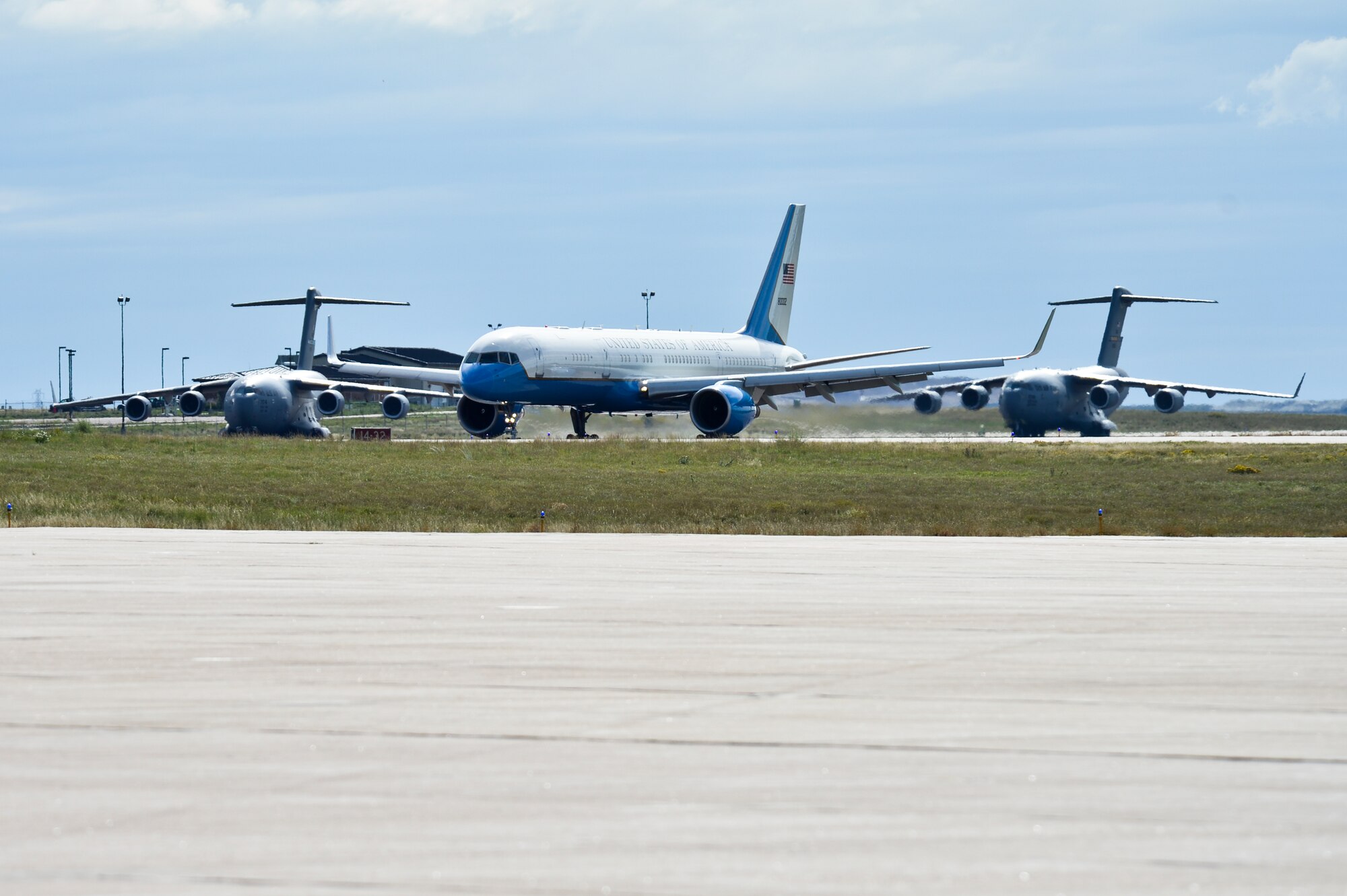 Air Force Two taxis near two C-17 Globemaster IIIs Sept. 23, 2013, on the flightline at Buckley Air Force Base, Colo. Biden visited Colorado to view the damage and survey recovery efforts after the flooding that killed at least eight people and ravaged at least 14 counties. (U.S. Air Force photo by Airman 1st Class Riley Johnson/Released)