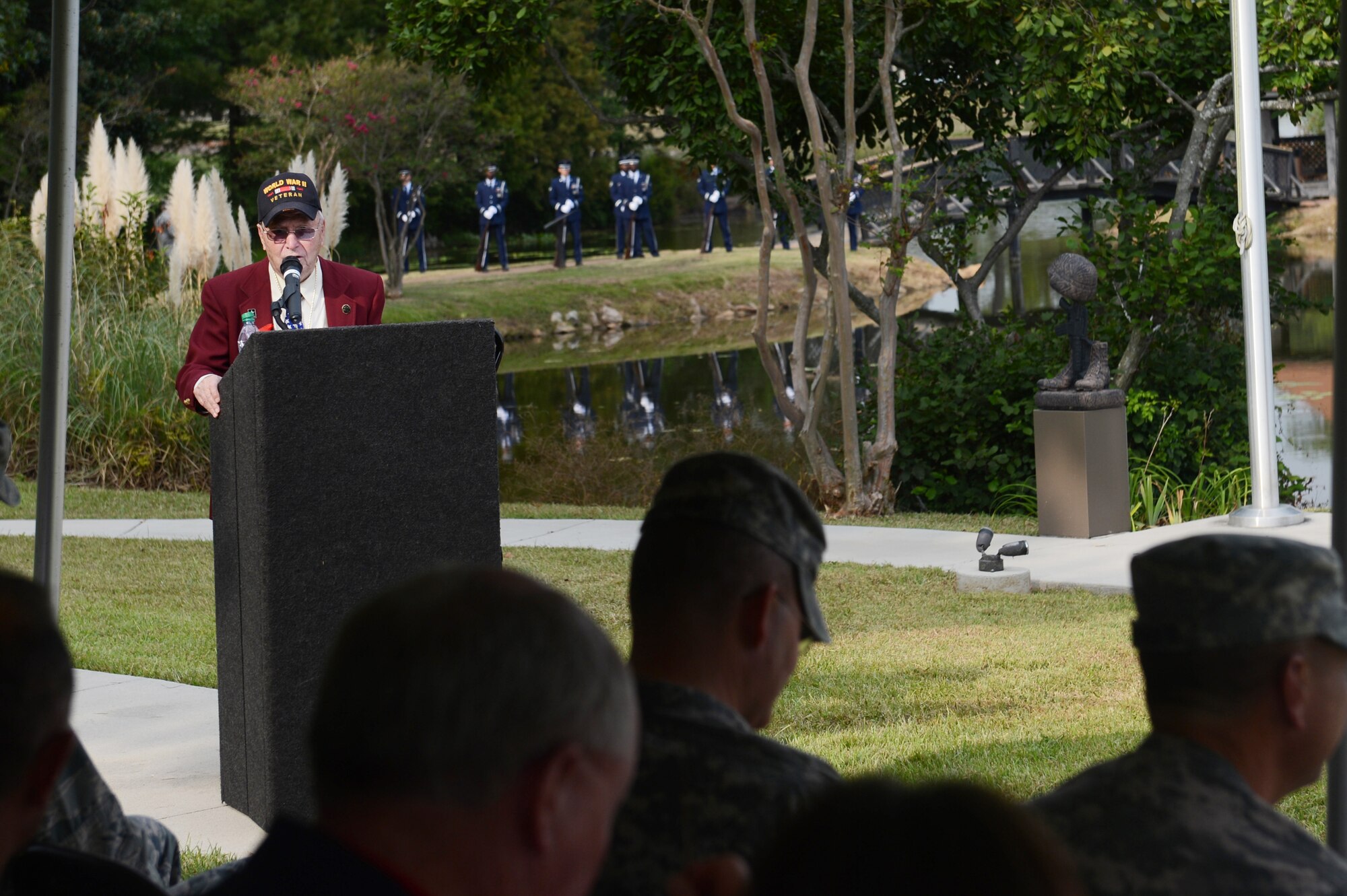 Thomas Grove, a World War II veteran, speaks about his experience as a prisoner of war during a retreat ceremony honoring POWs and missing in action Remembrance Day at Shaw Air Force Base, S.C., Sept. 20, 2013 . Following the retreat, there was a twenty-one-gun salute by the base honor guard. (U.S. Air Force photo by Airman 1st Class Krystal M. Jeffers/Released)