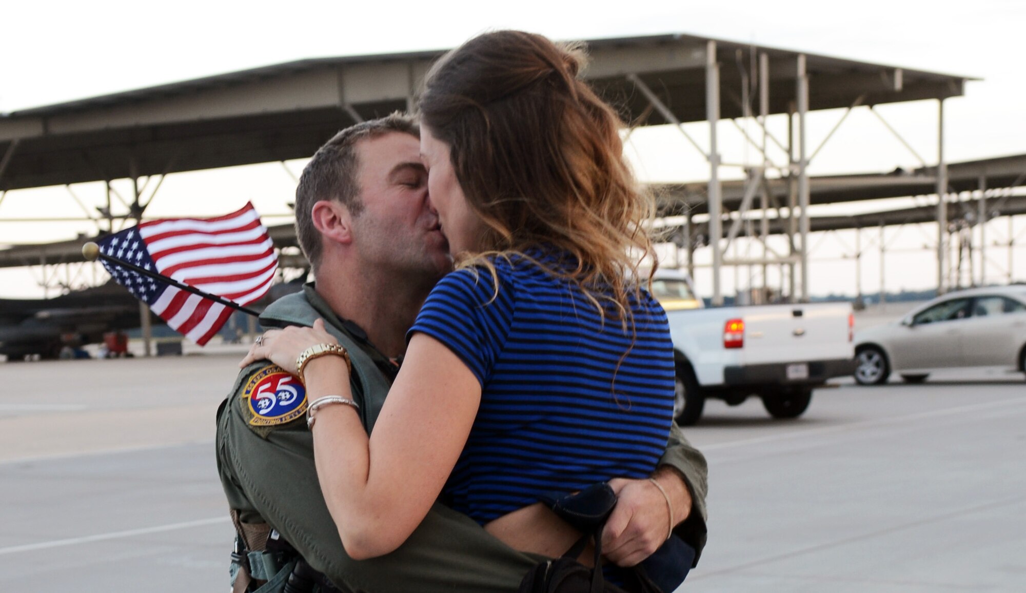 U.S. Air Force Maj. Ben Vickers, 55th Fighter Squadron F-16 Fighting Falcon pilot   kisses his wife Trisha after returning to Shaw, Sept. 18, 2013, Shaw Air Force Base, S.C. The 55th returned home from the Republic of Korea after being deployed for five months. (U.S. Air Force photo by Airman 1st Class Jonathan Bass/Released)