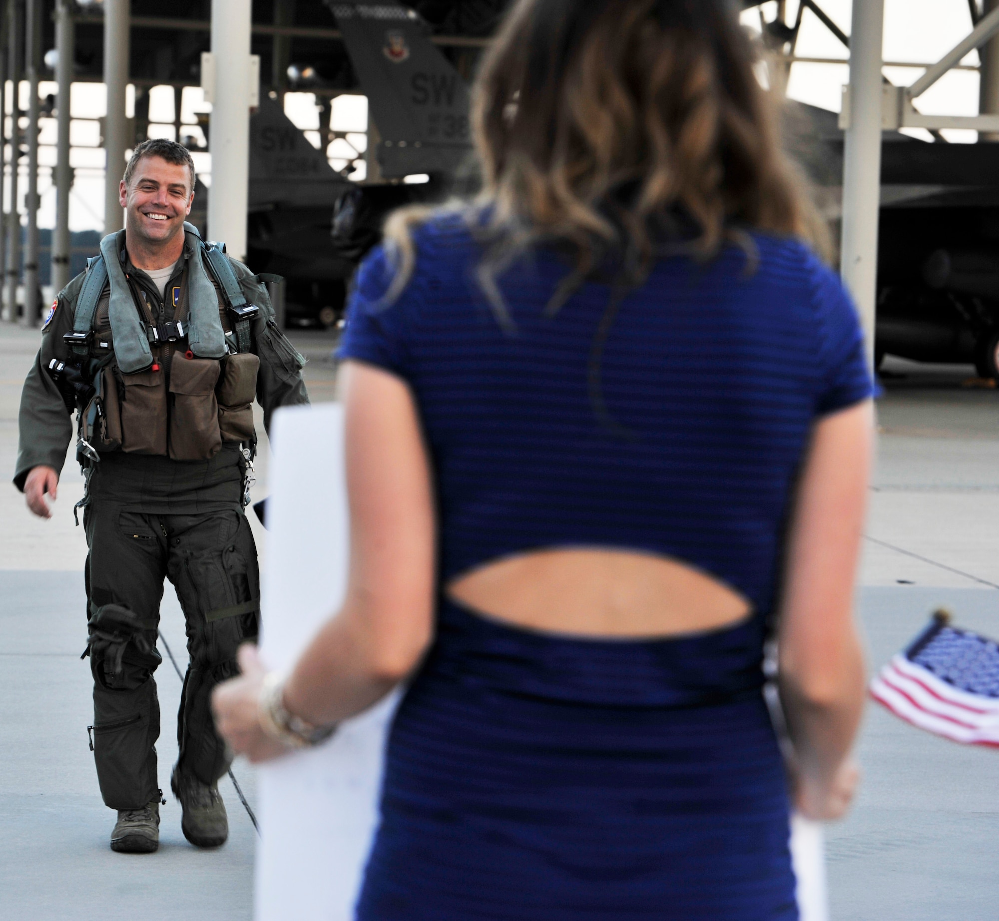 U.S. Air Force Maj. Ben Vickers, an 55th Fighter Squadron F-16 Fighting Falcon pilot  walks down the flight line, Sept 18, 2013, Shaw Air Force Base, S.C.. The 55th FS returned home from the Republic of Korea after being deployed for five months. (U.S. Air Force photo by Airman 1st Class Jonathan Bass/Released) 