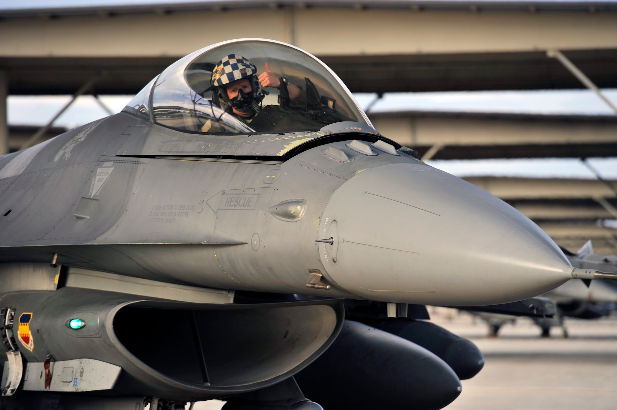 U.S. Air Force 1st Lt. Taylor Tally, 55th Fighter Squadron F-16 Fighting Falcon pilot, gives a thumbs up from the cockpit of his plane after landing Sept. 18, 2013, Shaw Air Force Base, S.C. The 55th FS was deployed to the Republic of Korea for the last five months. (U.S. Air Force photo by Airman 1st Class Jonathan Bass/Released)
